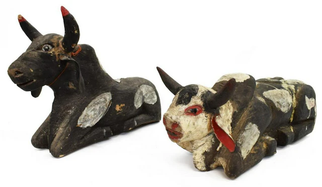 (2) MEXICAN CARVED WOOD PAINTED RECUMBENT COWS