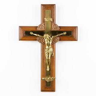 A crucifix with small holy water font, bronze mounted on wood.