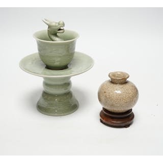 A Chinese celadon glazed 'dragon' puzzle cup and stand, earl...