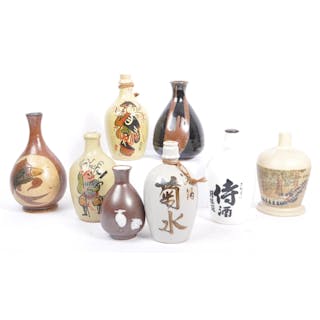 A collection of vintage 20th century Japanese sake bottles a...
