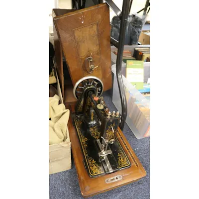 Victorian walnut cased hand crank sewing machine by Frister ... | Barnebys