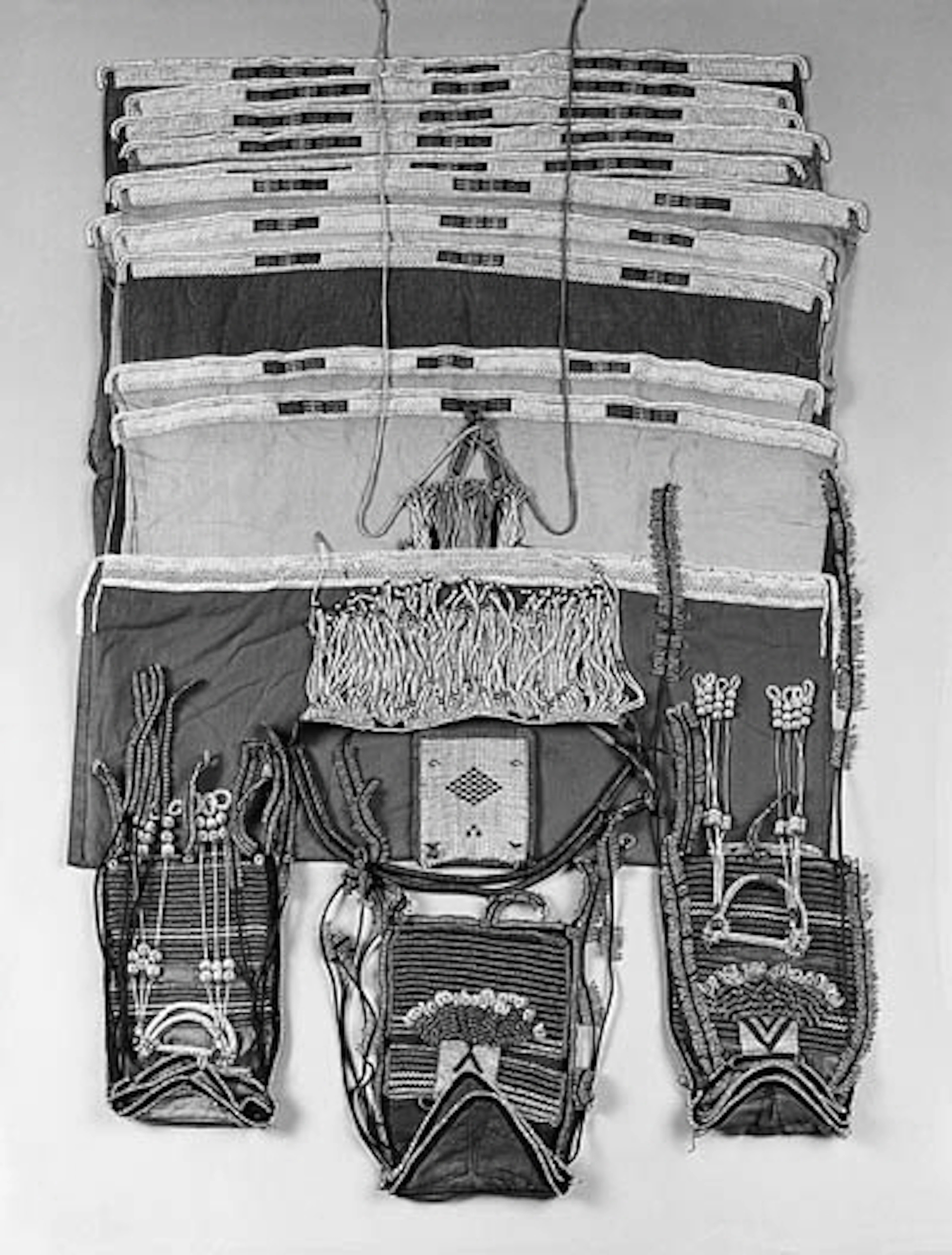 A NGWANE WEDDING CAPE, THREE TOBACCO BAGS, A POUCH AND AN APRON