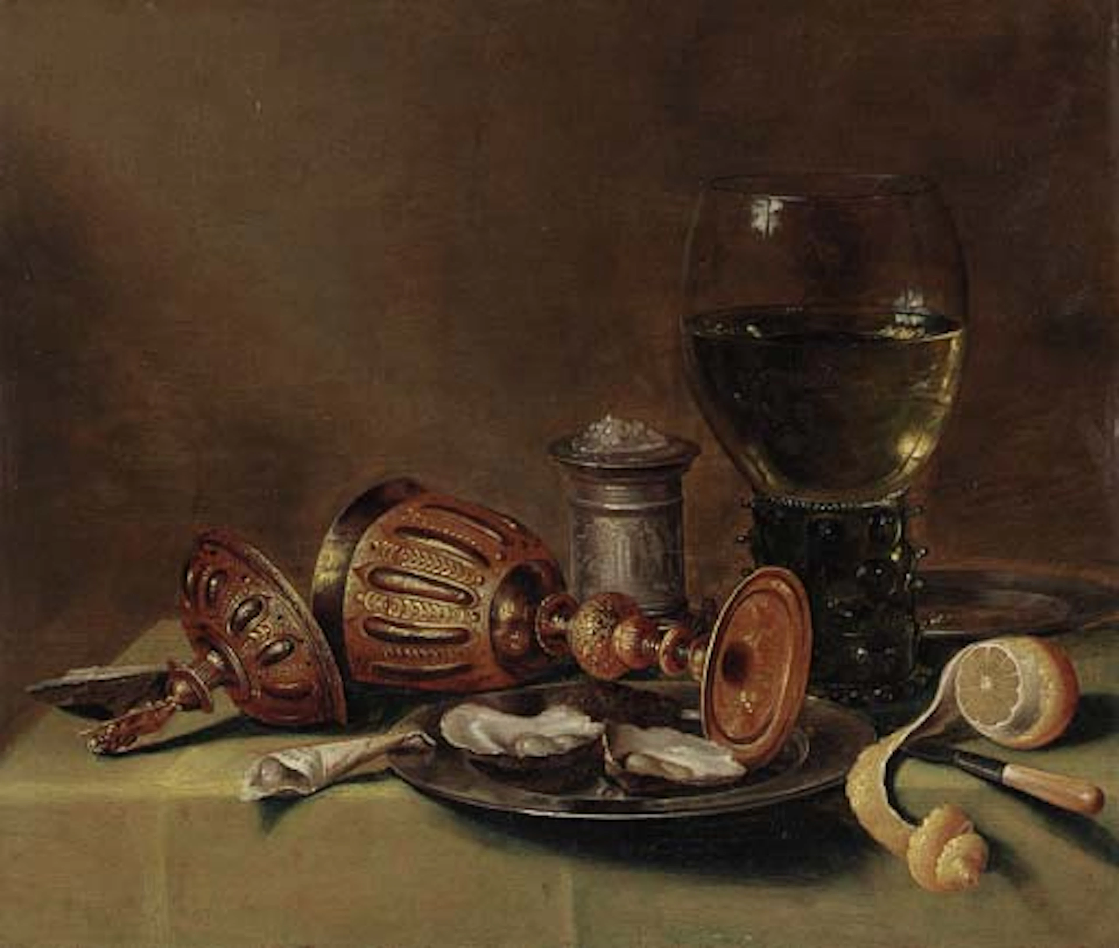 A roemer, an overturned goblet, oysters on a pewter plate, a silver salt, a knife and a peeled lemon on a draped table