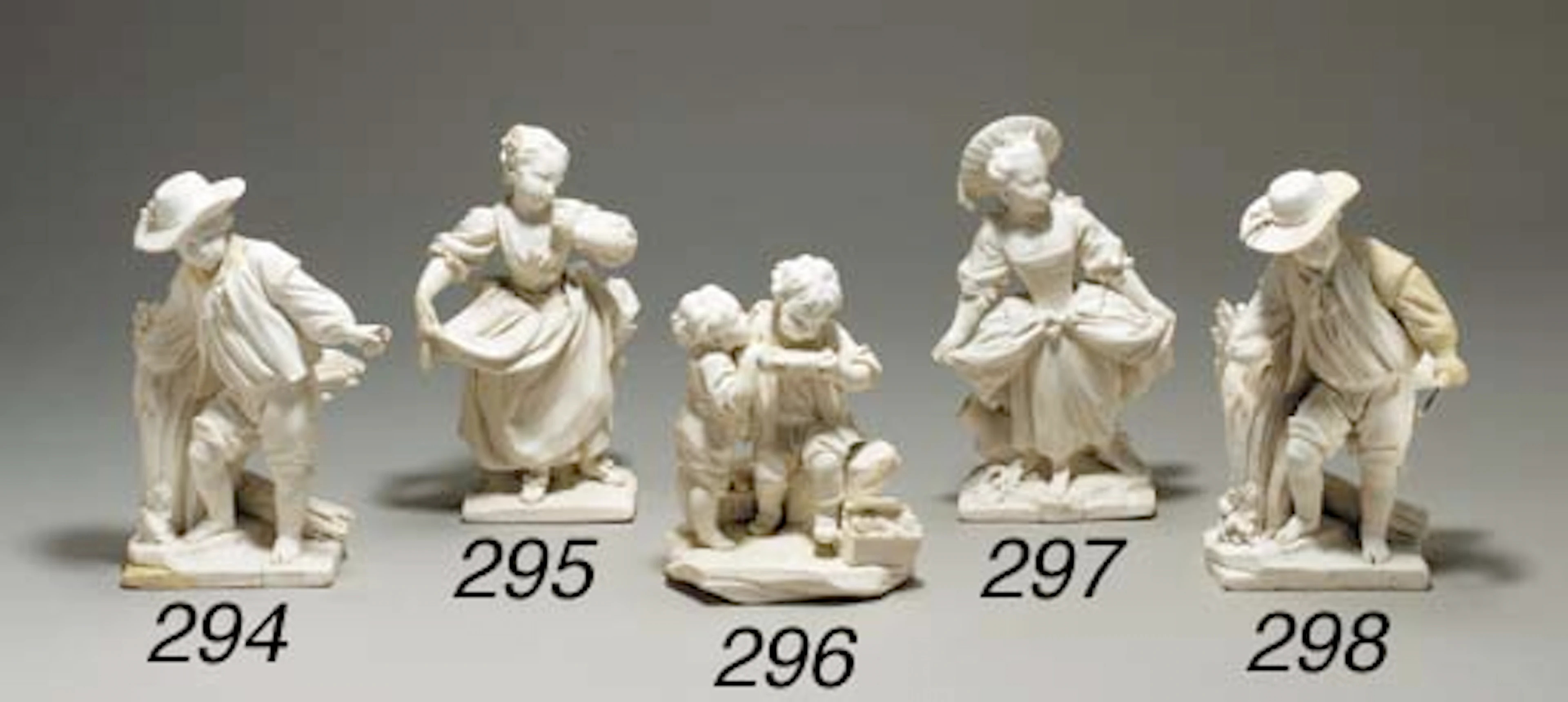 A SEVRES BISCUIT FIGURE GROUP OF 'LES GOURMANDS' OR 'LES ENFANTS BUVEURS DE LAIT'