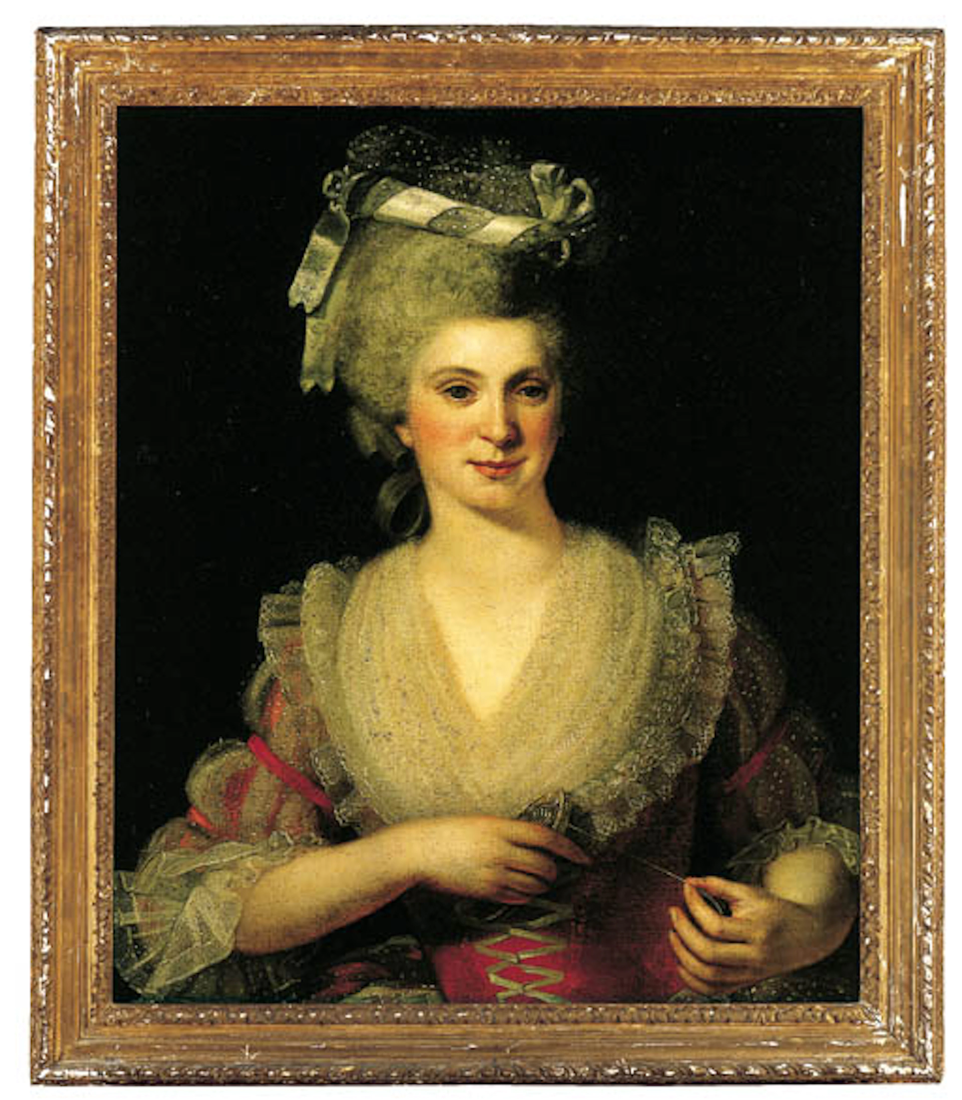 Portrait of a lady, half-length, in a lace head dress and an embroidered red dress with a lace-trimmed collar
