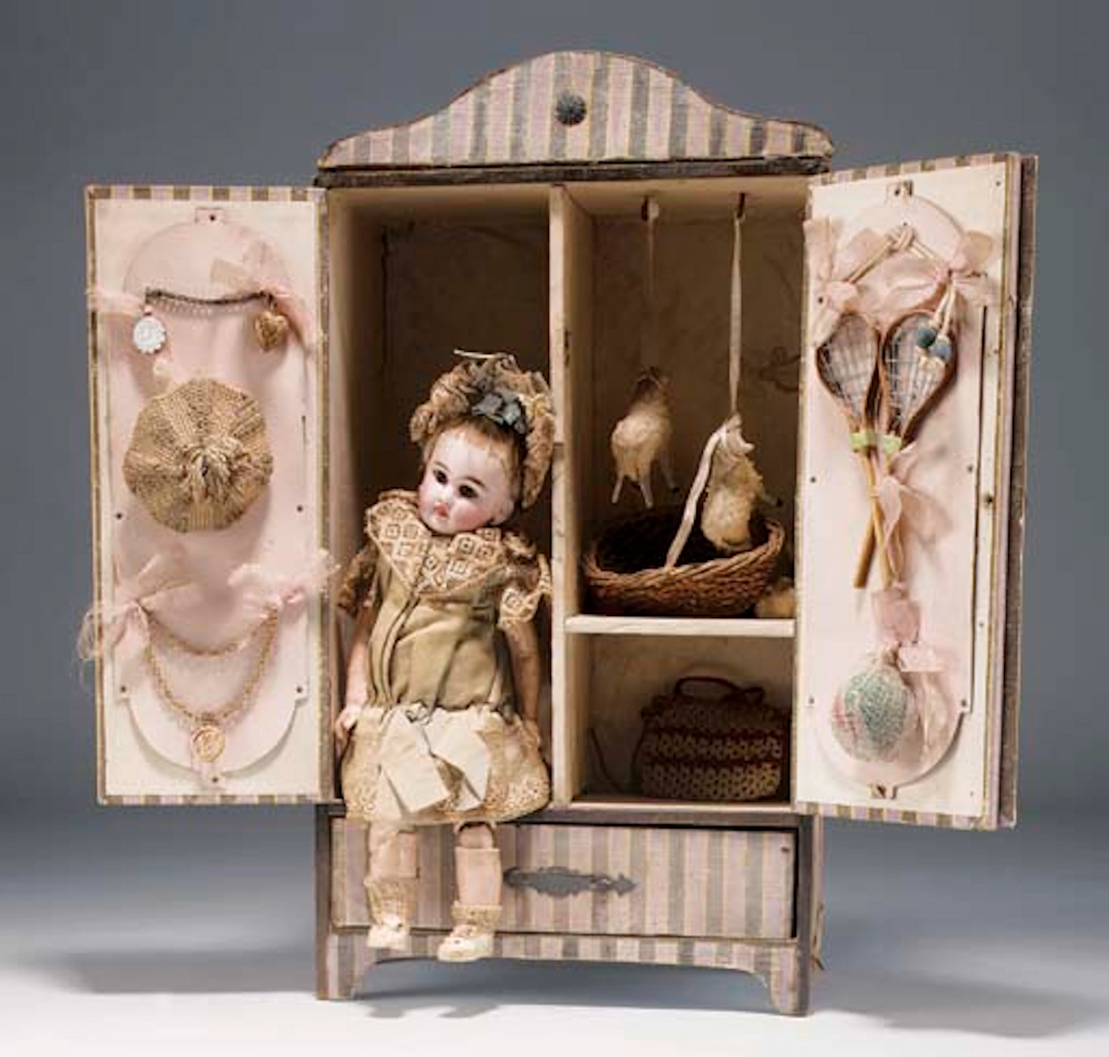 A Kestner child doll and wardrobe