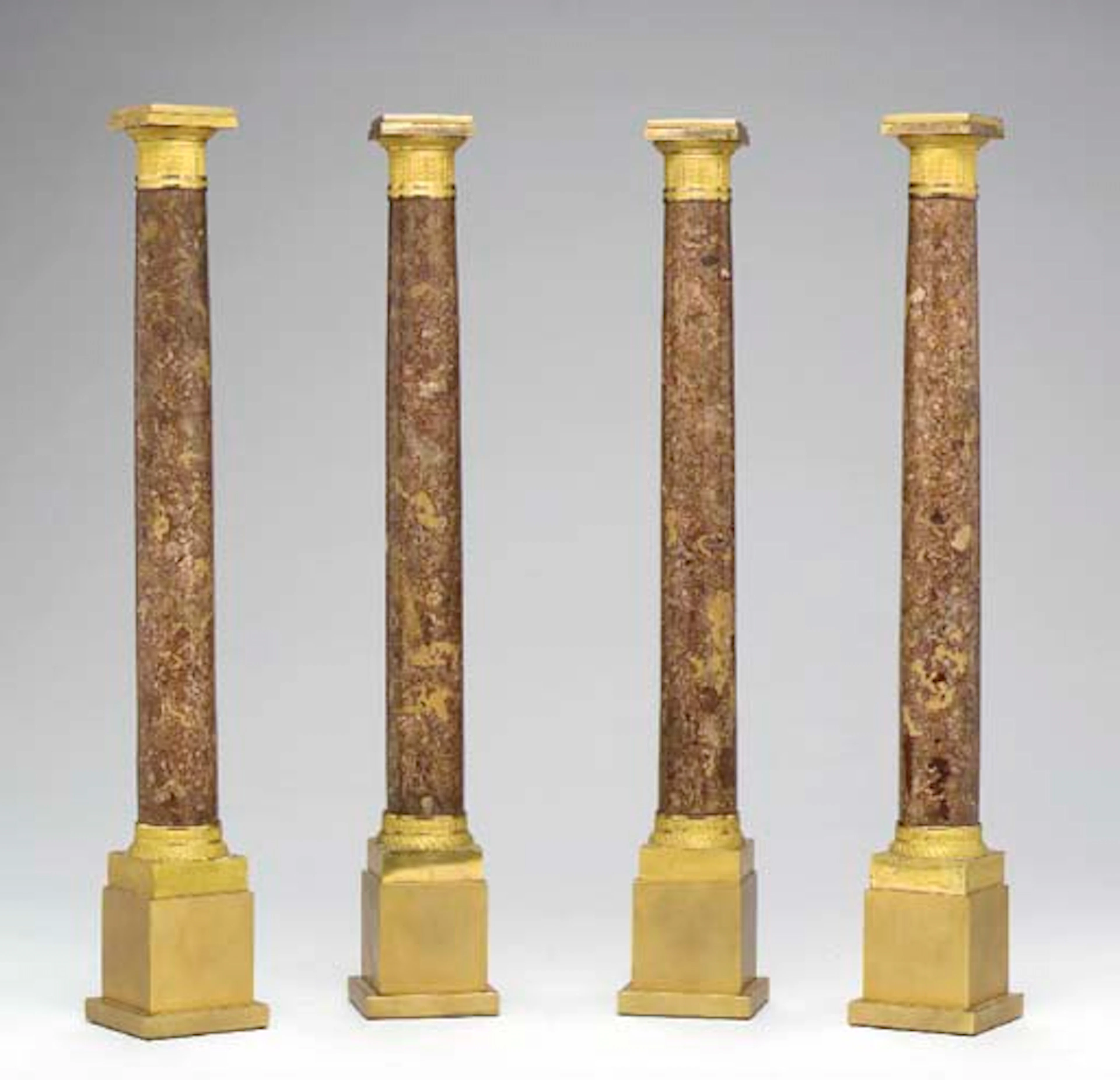 A SET OF FOUR EMPIRE ORMOLU AND SPANISH BROCATELLE MARBLE COLUMNS,