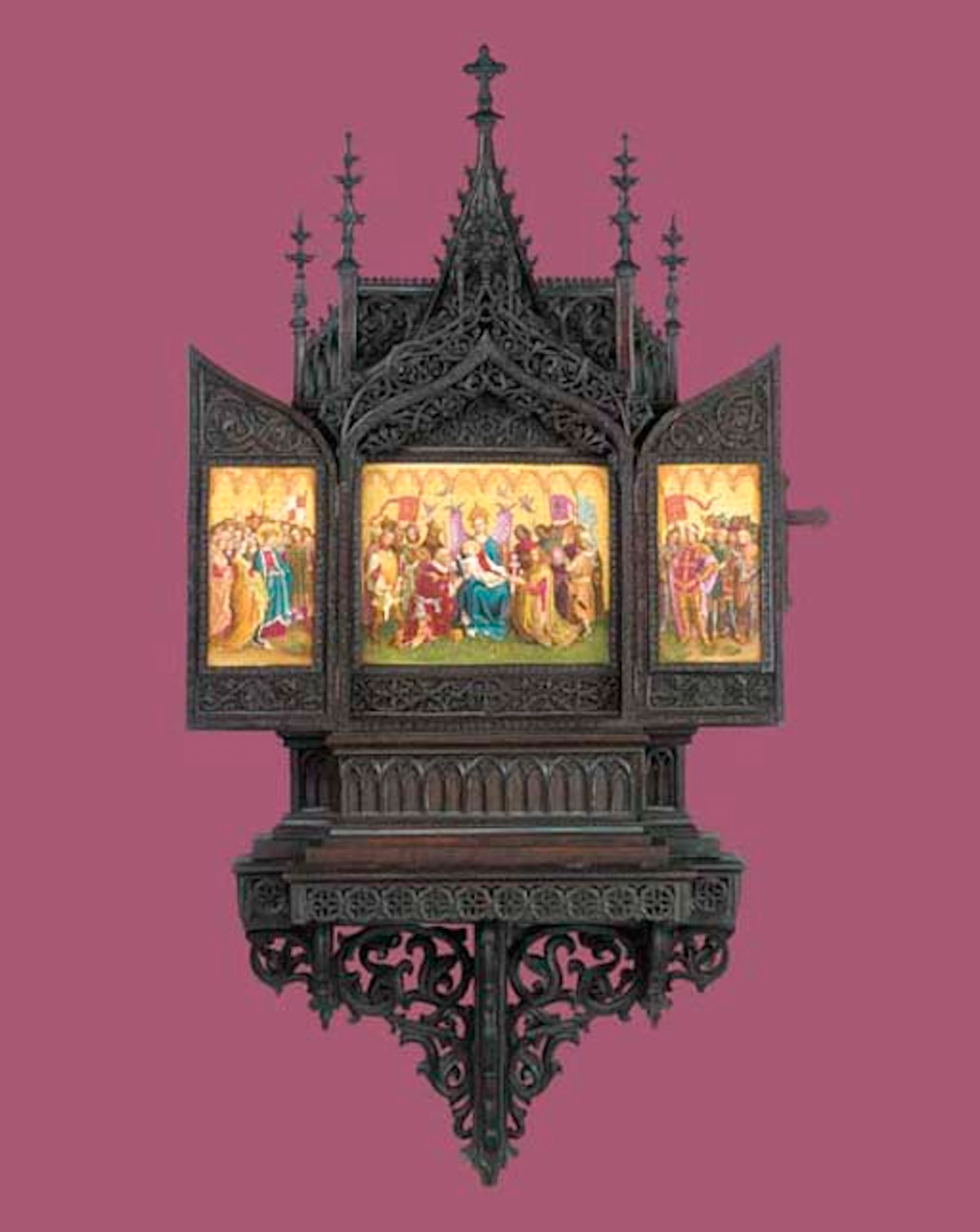 A Gothic revival Berlin (KPM) mounted carved oak triptych