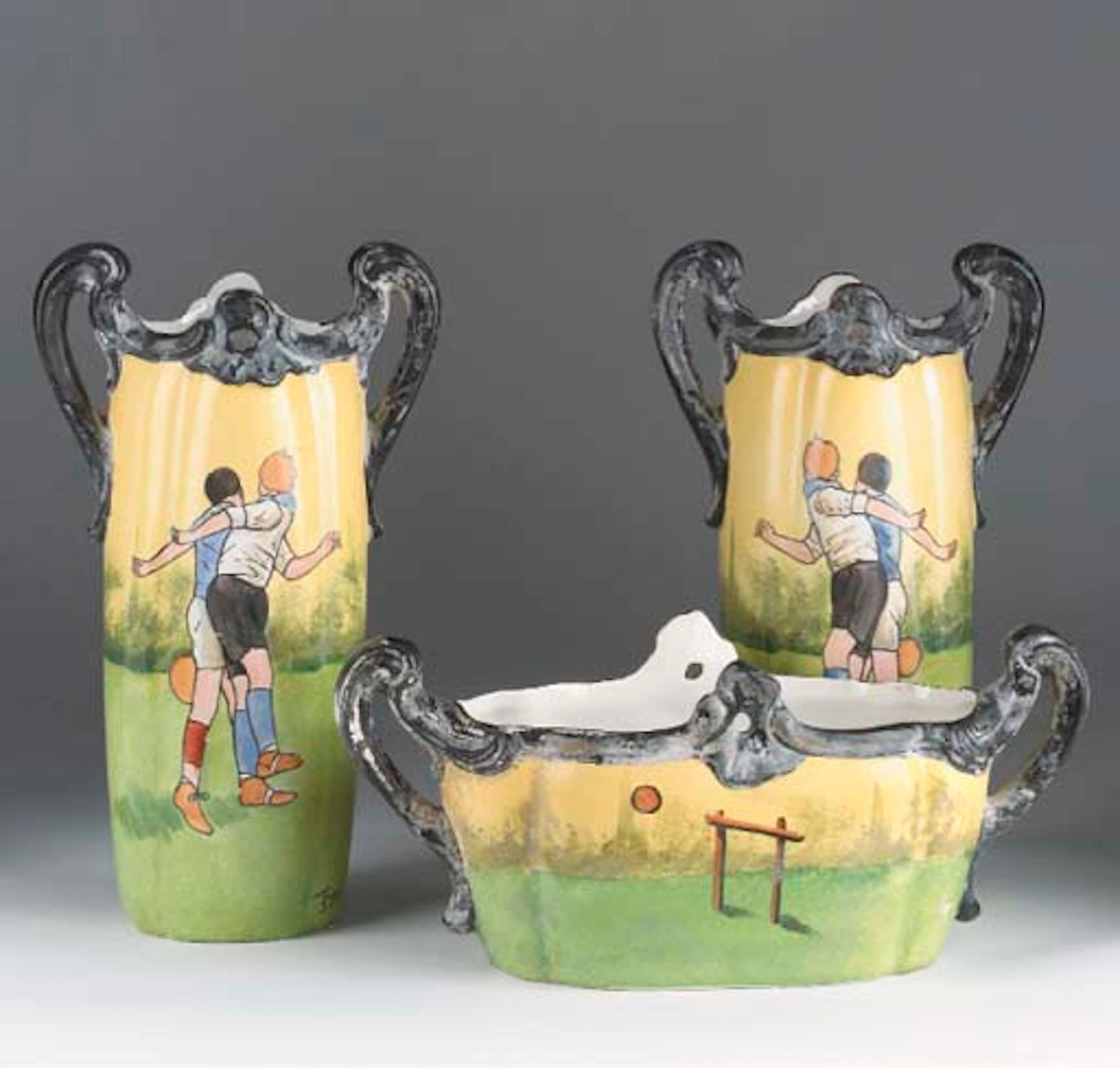 A CONTINENTAL PAINTED PORCELAIN GARNITURE