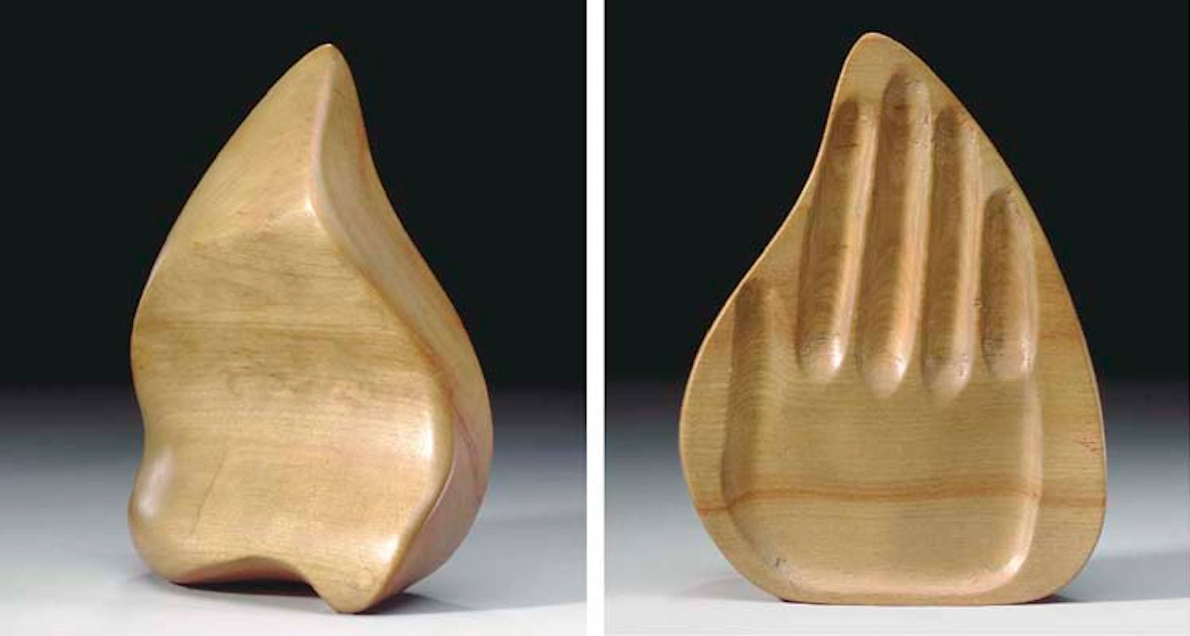 A TURNED AND CARVED WOOD 'HAND-HELD' SCULPTURE