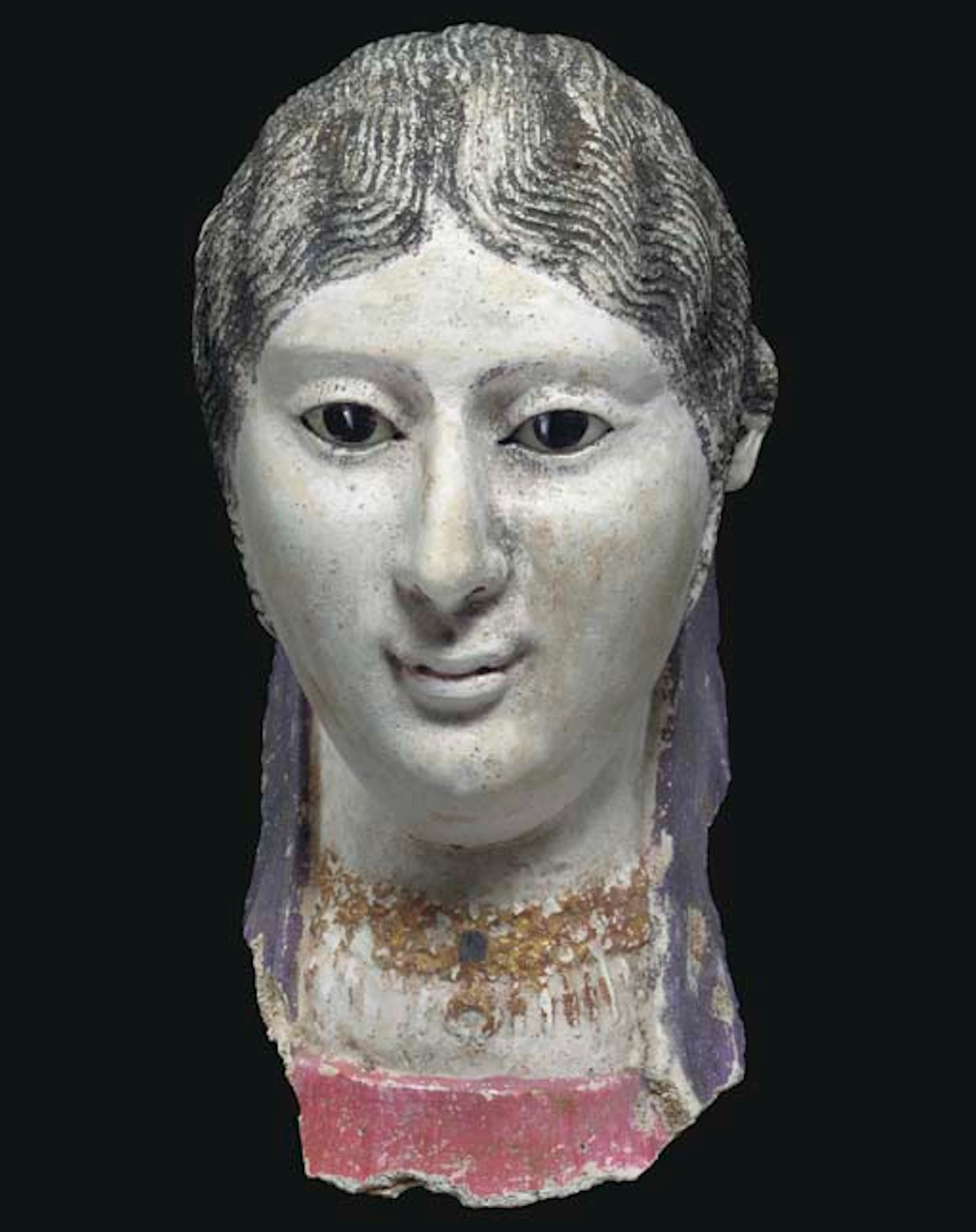 AN EGYPTIAN PLASTER MUMMY PORTRAIT OF A WOMAN