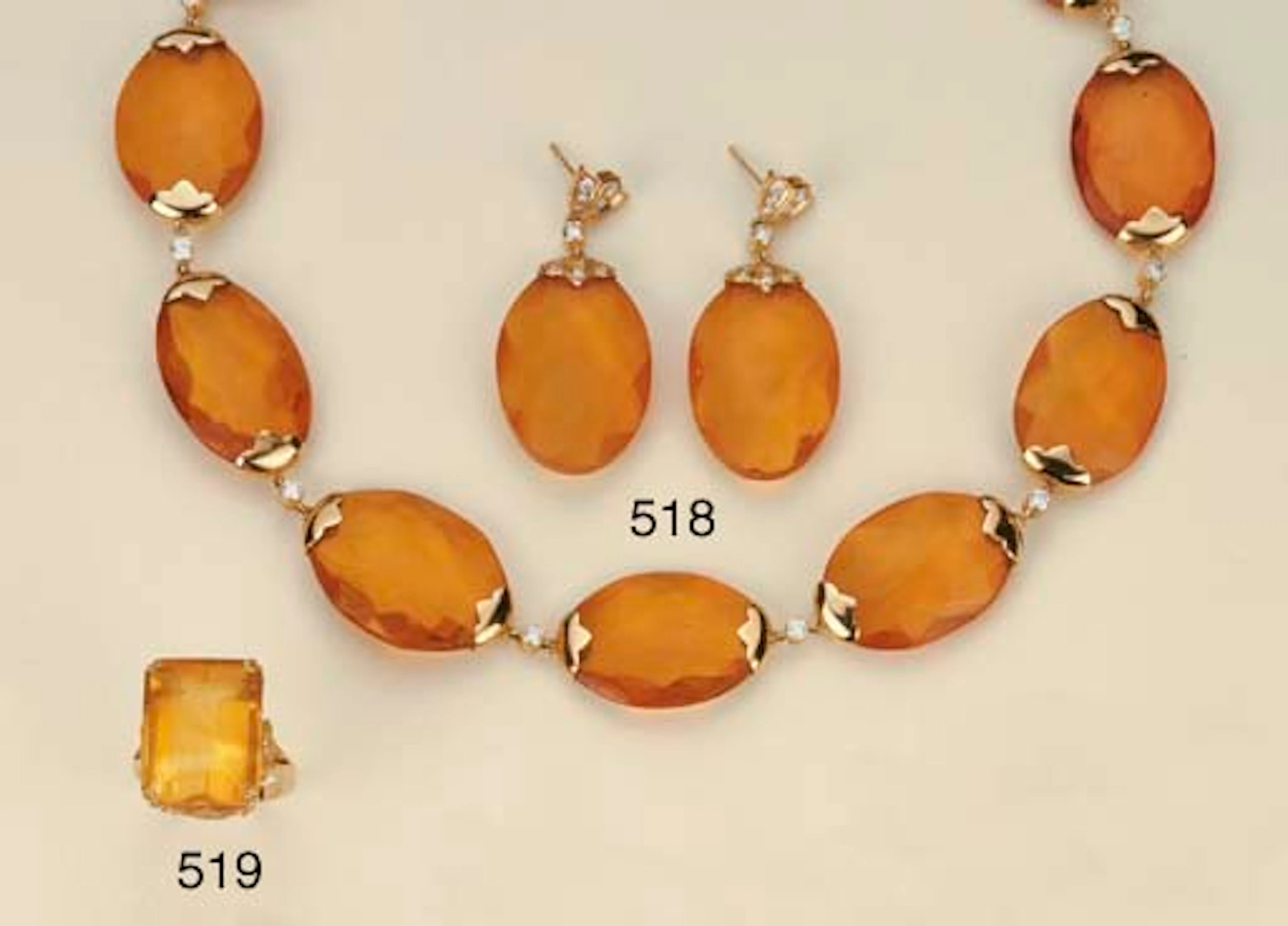 Demi parure in oro, ambra e brillanti