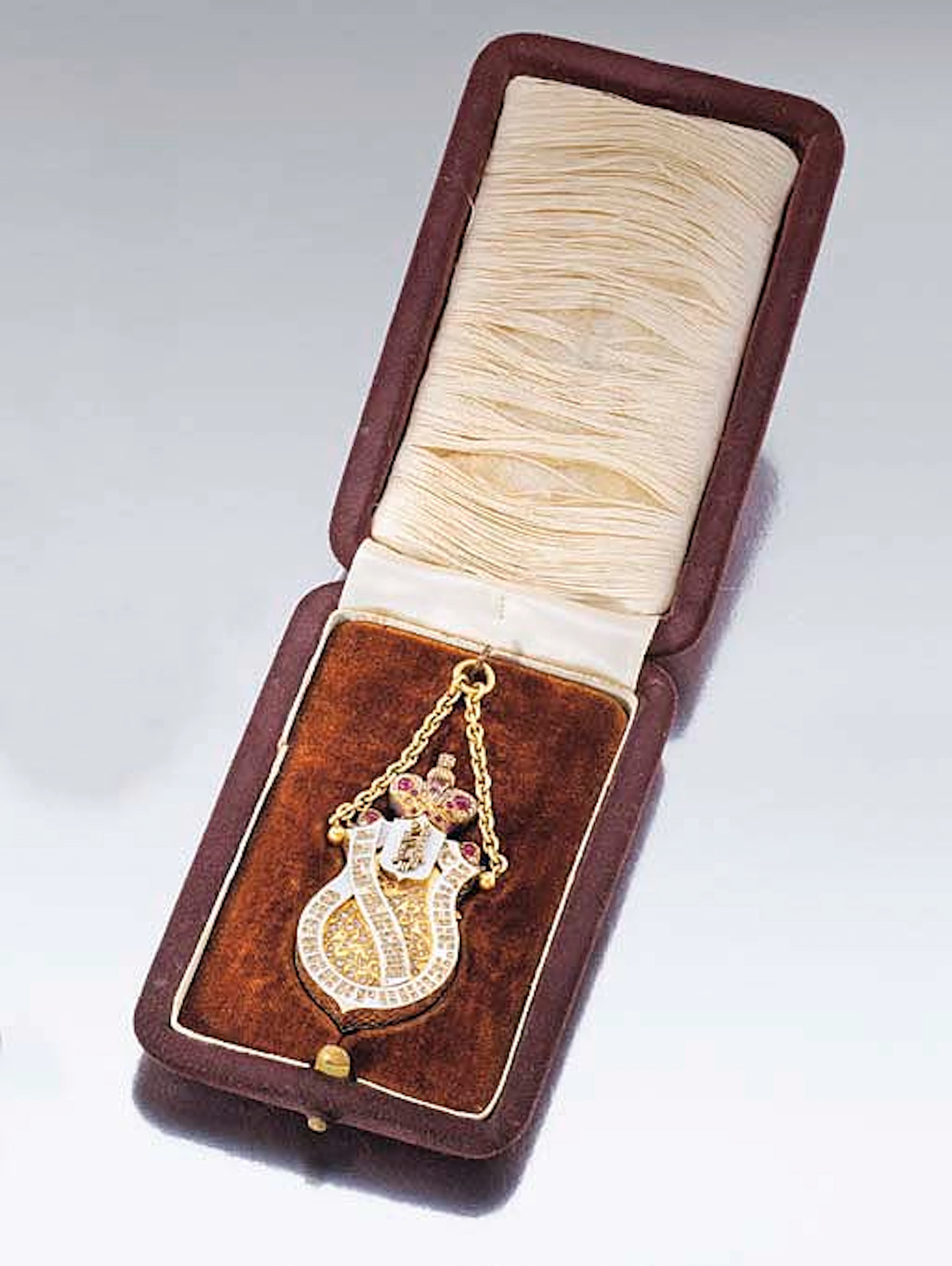 Liebermann. An unusual 18K gold, enamel, diamond and ruby-set shield-shaped keyless pendant watch