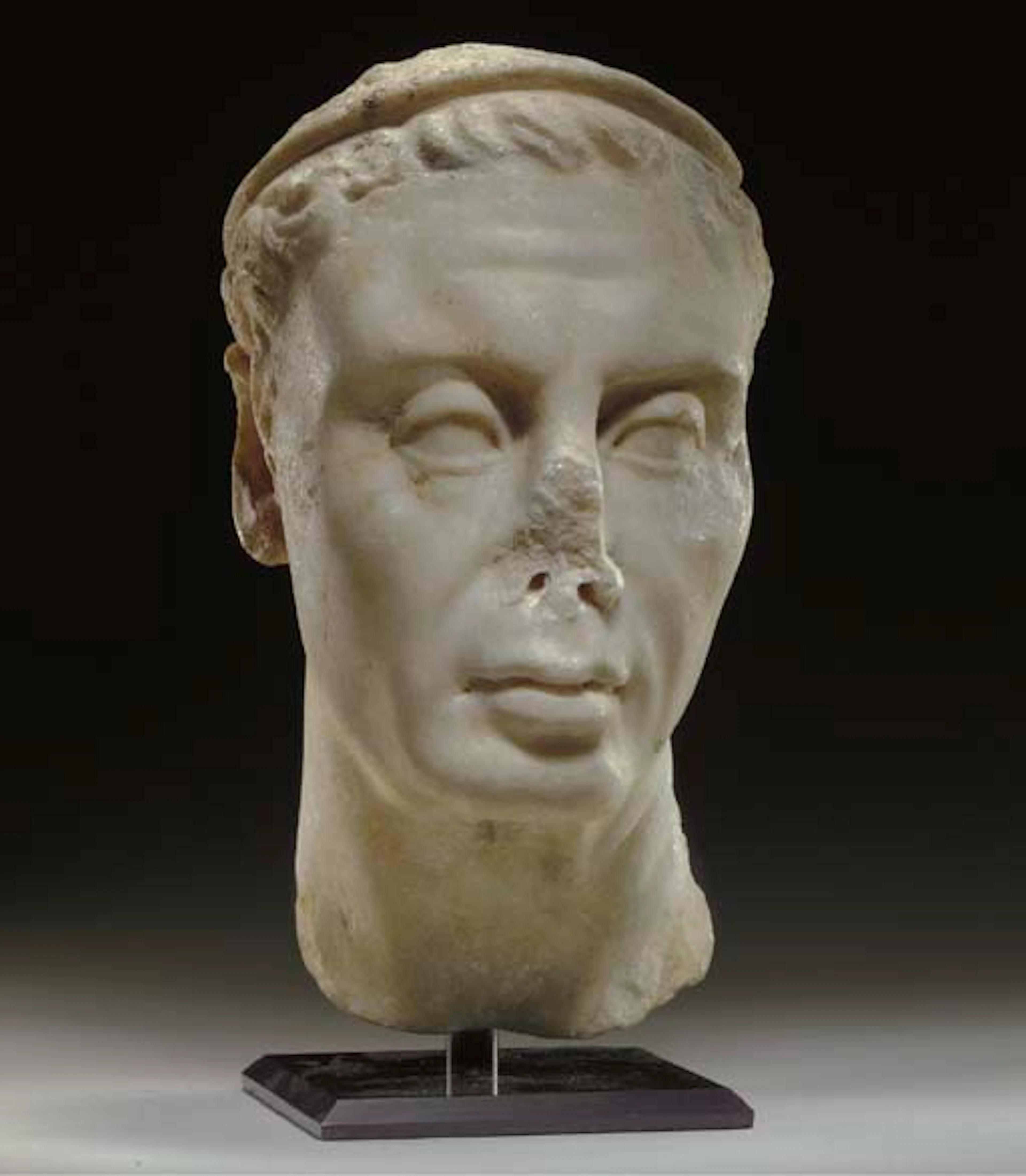 A GREEK MARBLE PORTRAIT HEAD OF A HELLENISTIC KING