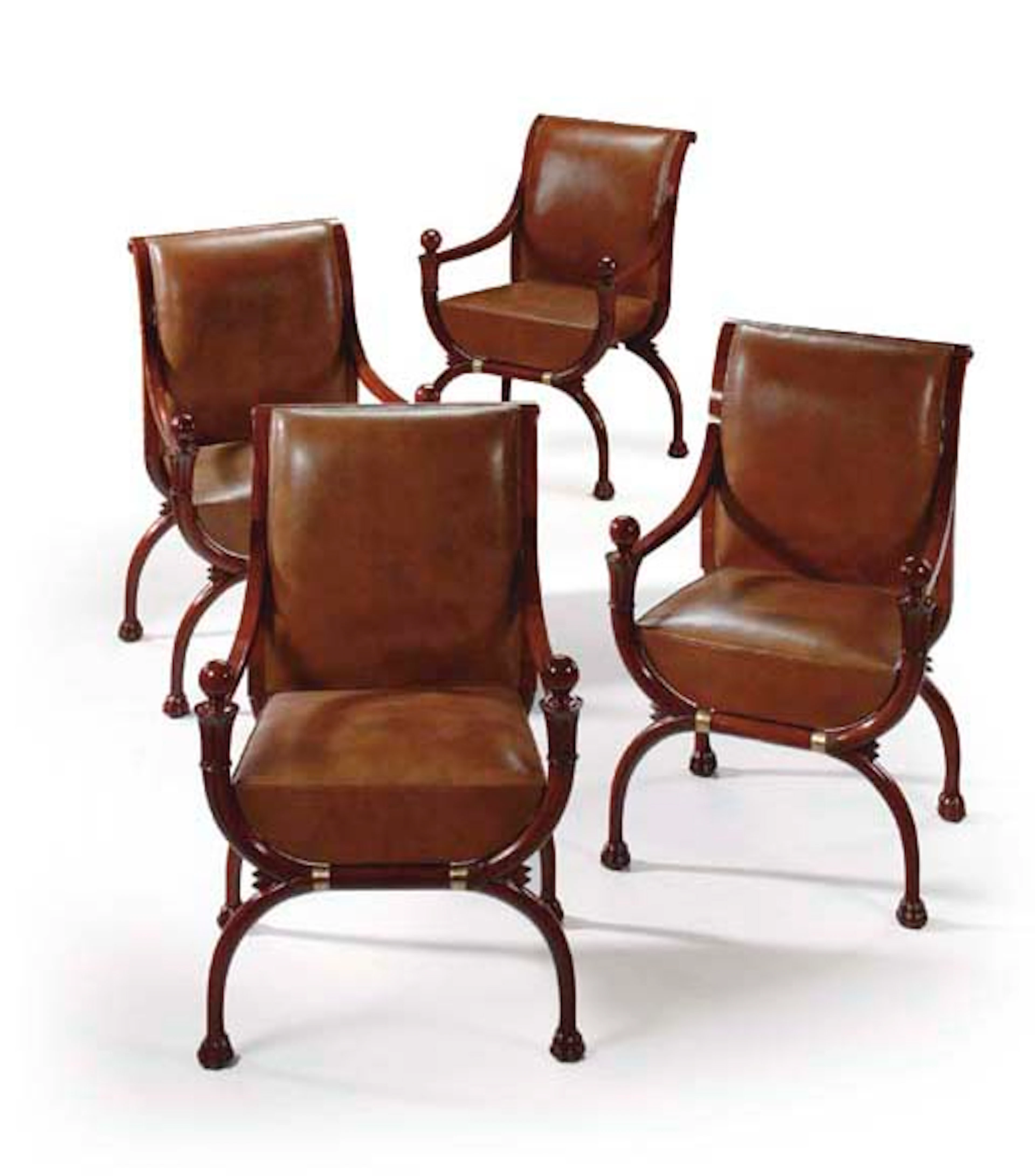 A SET OF FOUR DIRECTOIRE MAHOGANY FAUTEUILS EN CURULE