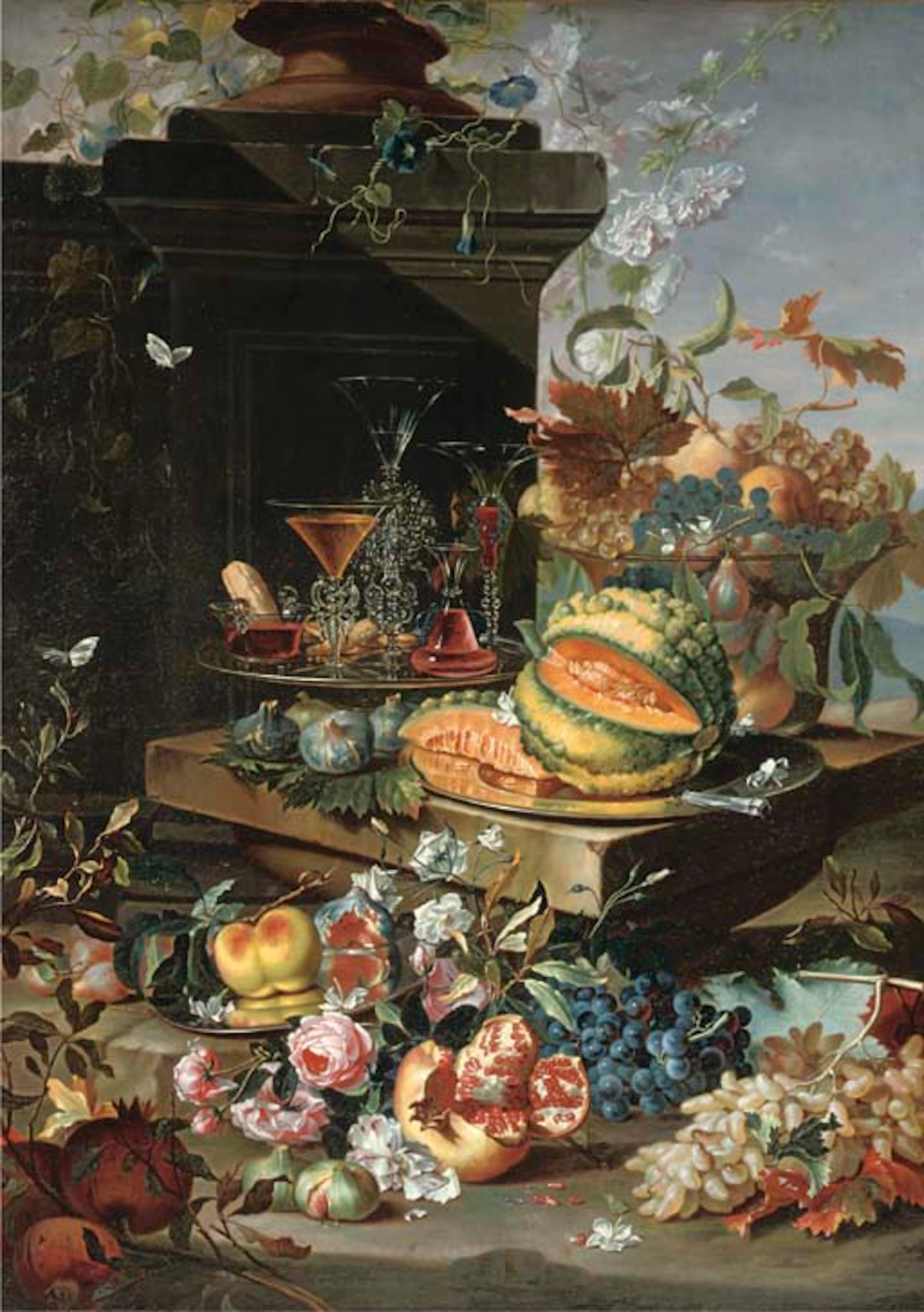 A sliced pumpkin on a silver plate, 'façon-de-venise' glasses on a second silver plate, grapes, peaches and plums in a glass bowl with more grapes, figs, a pomegranate,