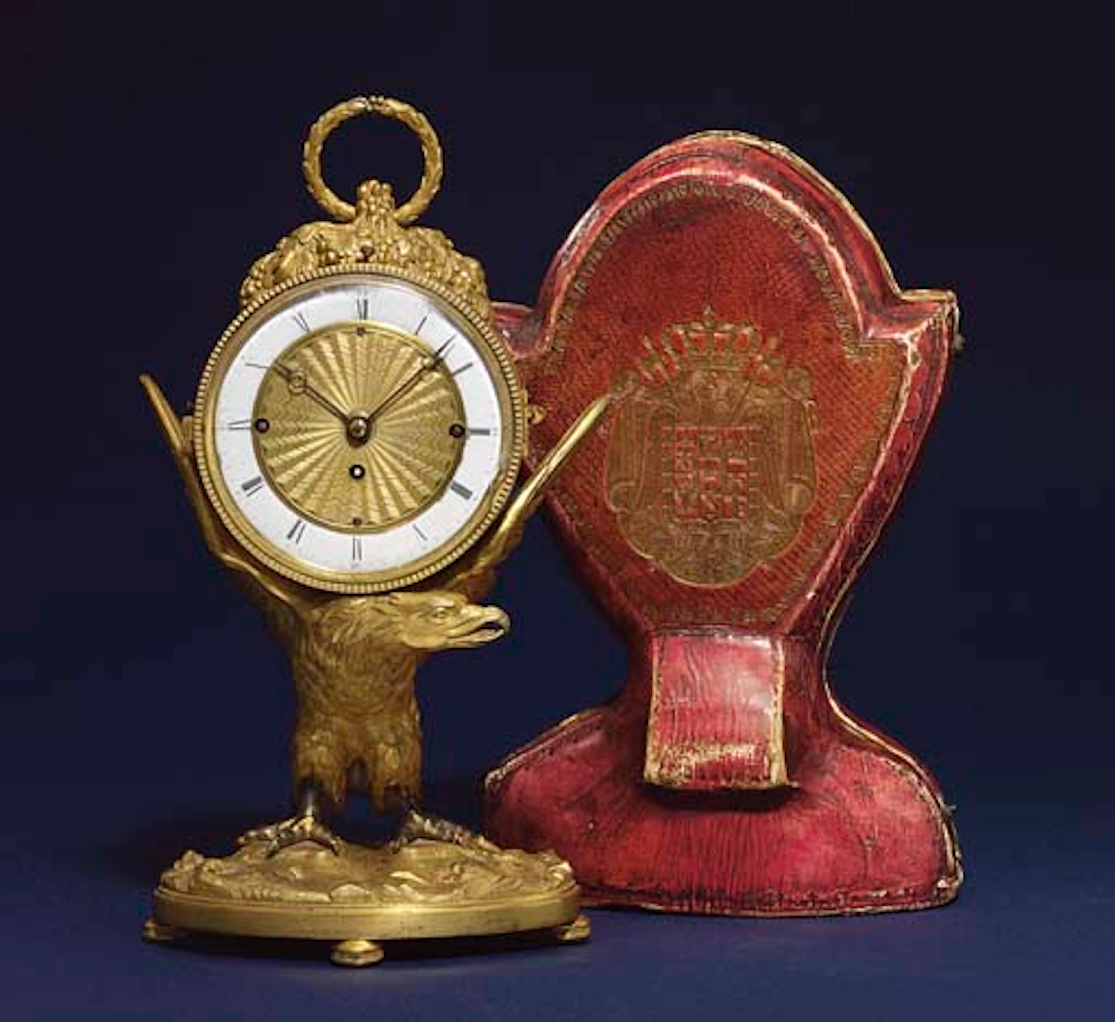AN AUSTRIAN ORMOLU PETITE SONNERIE TRAVEL CLOCK WITH TRAVEL CASE DECORATED WITH THE ARMS OF NAPOLEON I AS KING OF ITALY