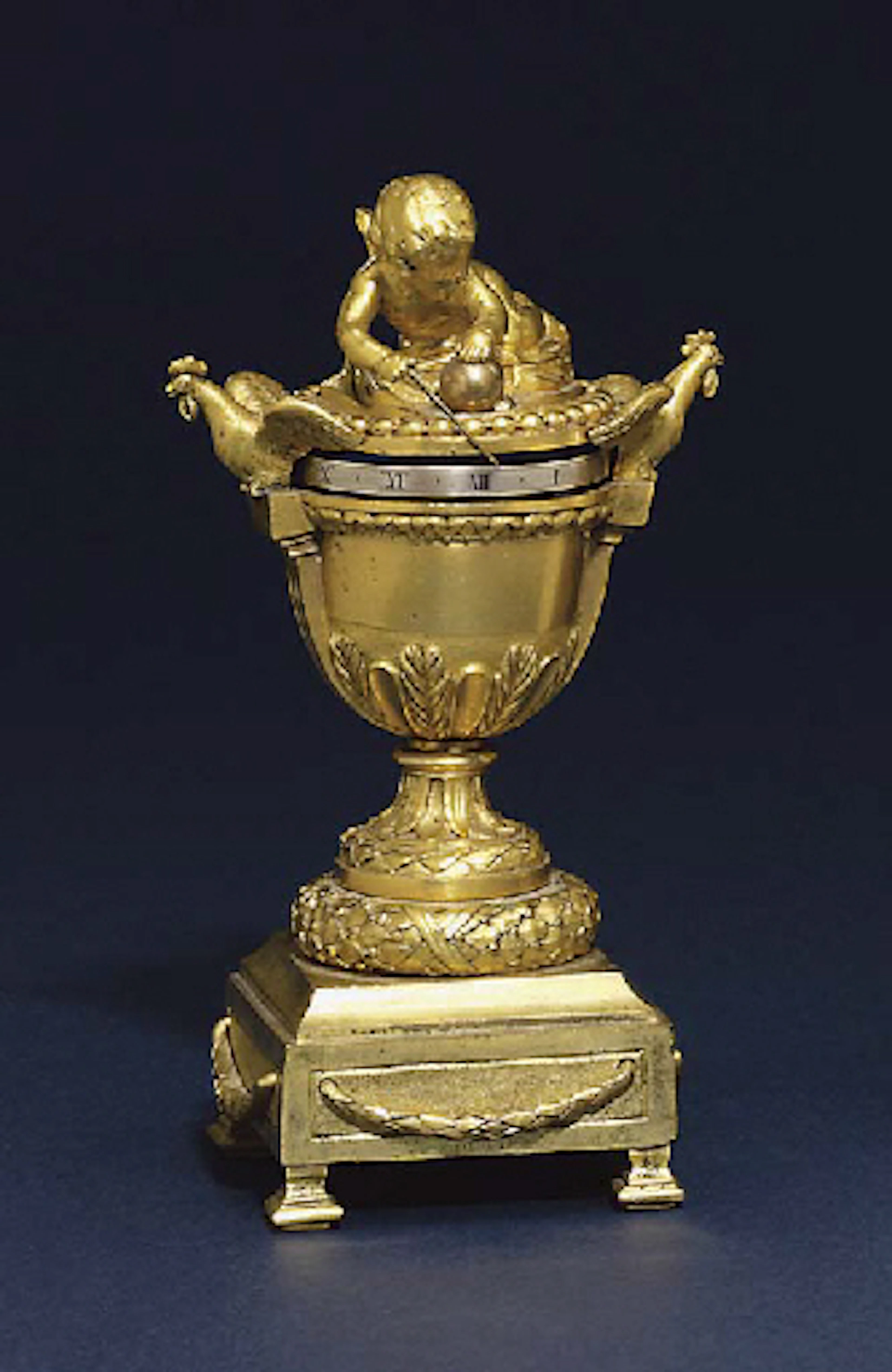 A rare Louis XVI miniature ormolu pendule a cadran tournant