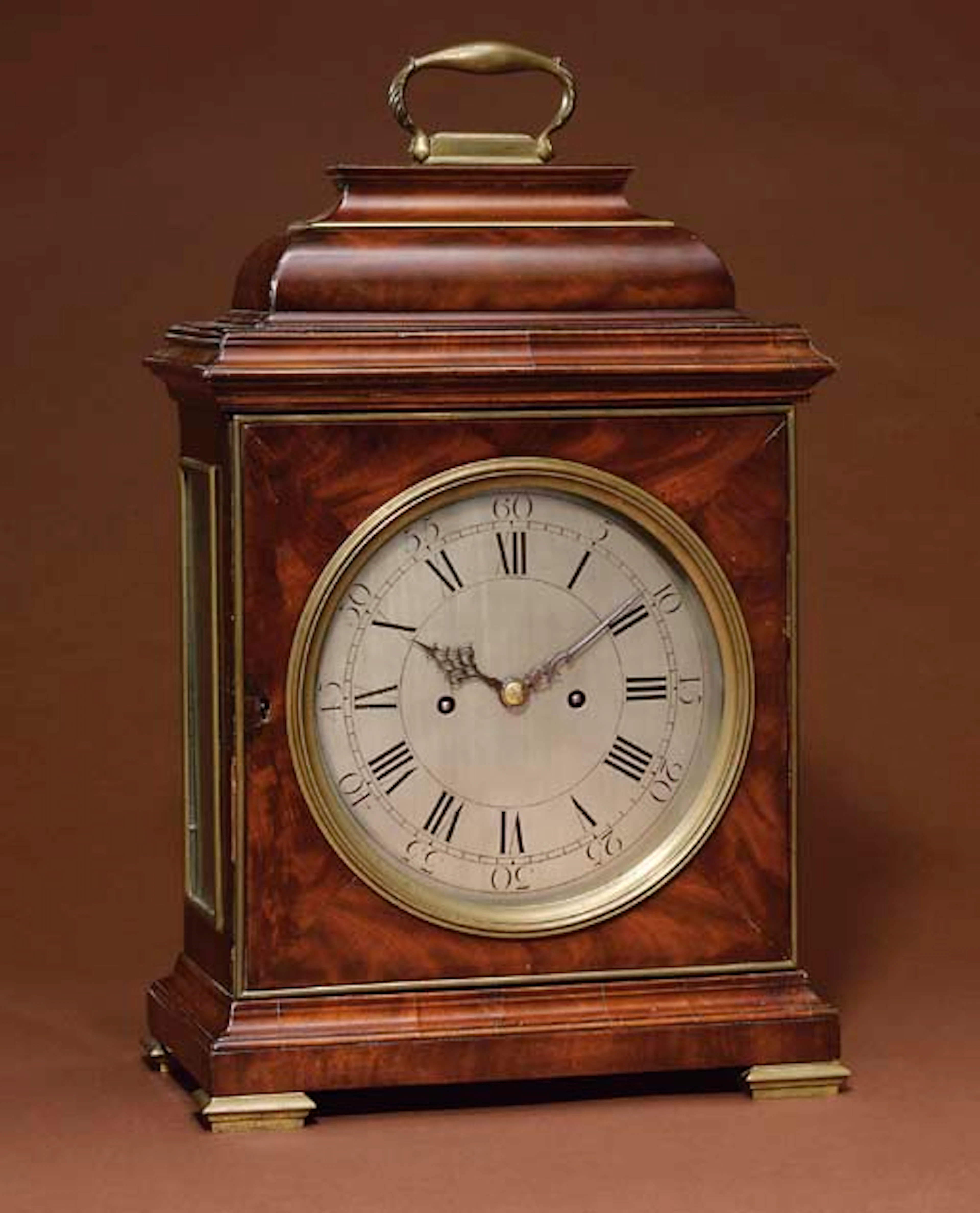 A George II mahogany and brass-mounted striking eight day table clock with pull quarter repeat