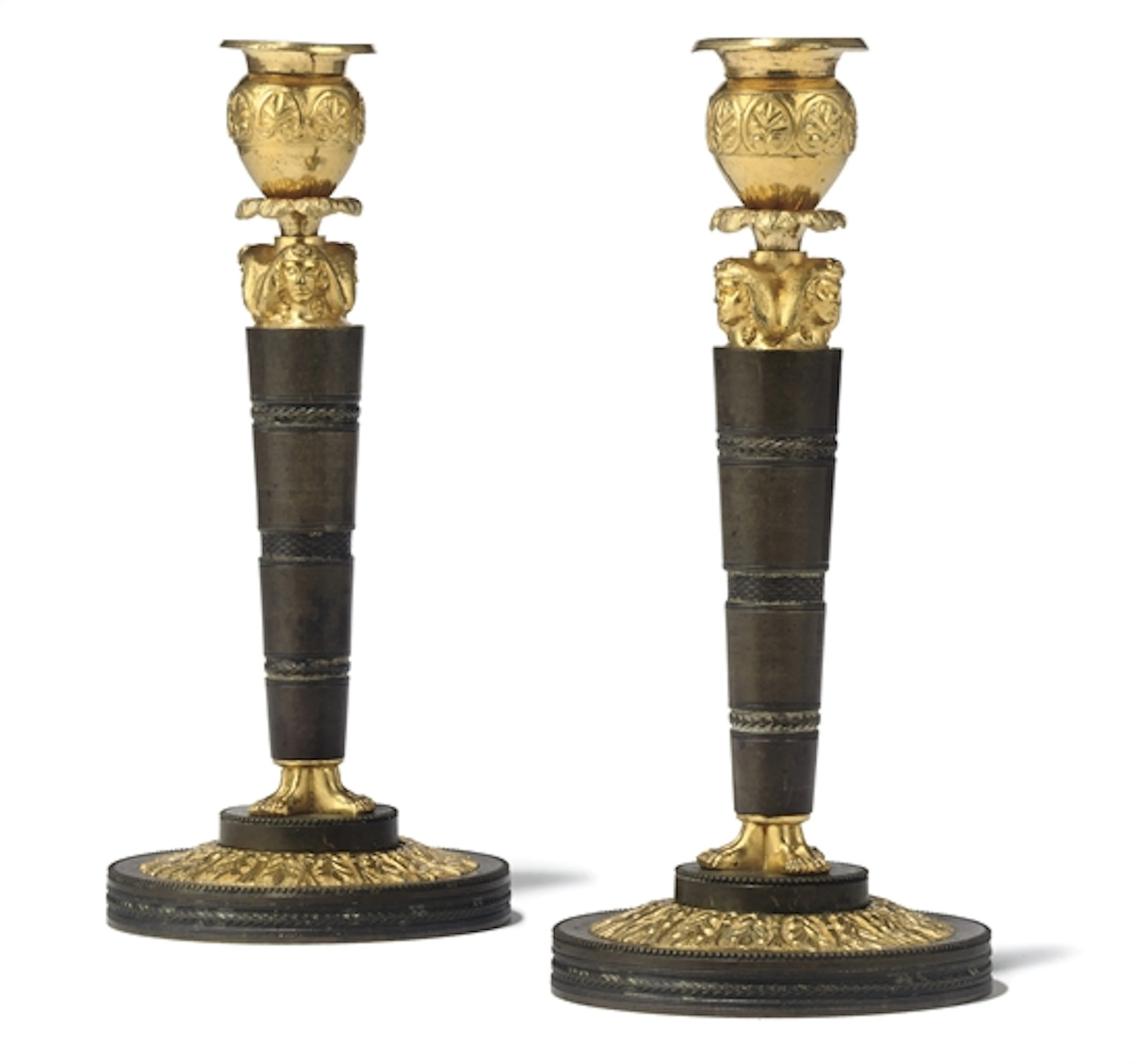 A PAIR OF RUSSIAN ORMOLU AND PATINATED BRONZE CANDLESTICKS