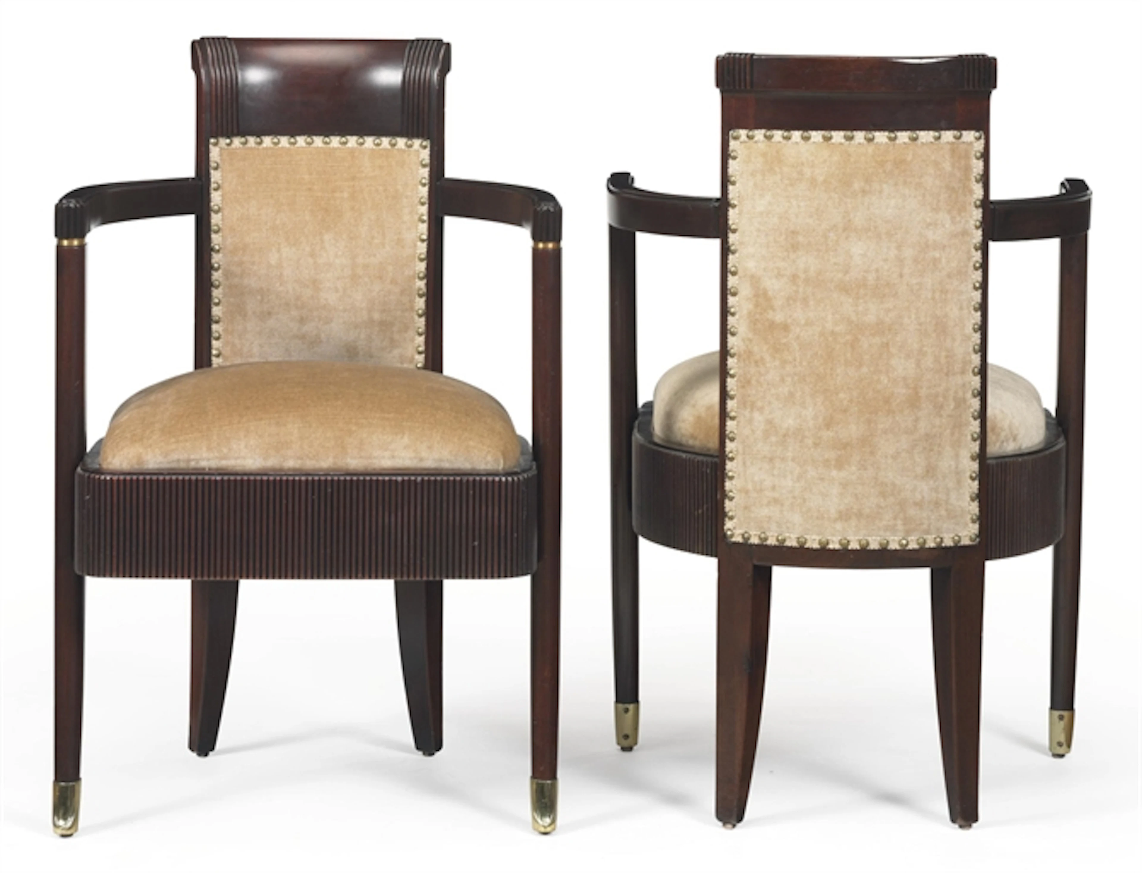 A PAIR OF UPHOLSTERED MAHOGANY ARMCHAIRS FROM THE FIRST-CLASS DINING ROOM OF THE S.S. NORMANDIE, CIRCA 1935