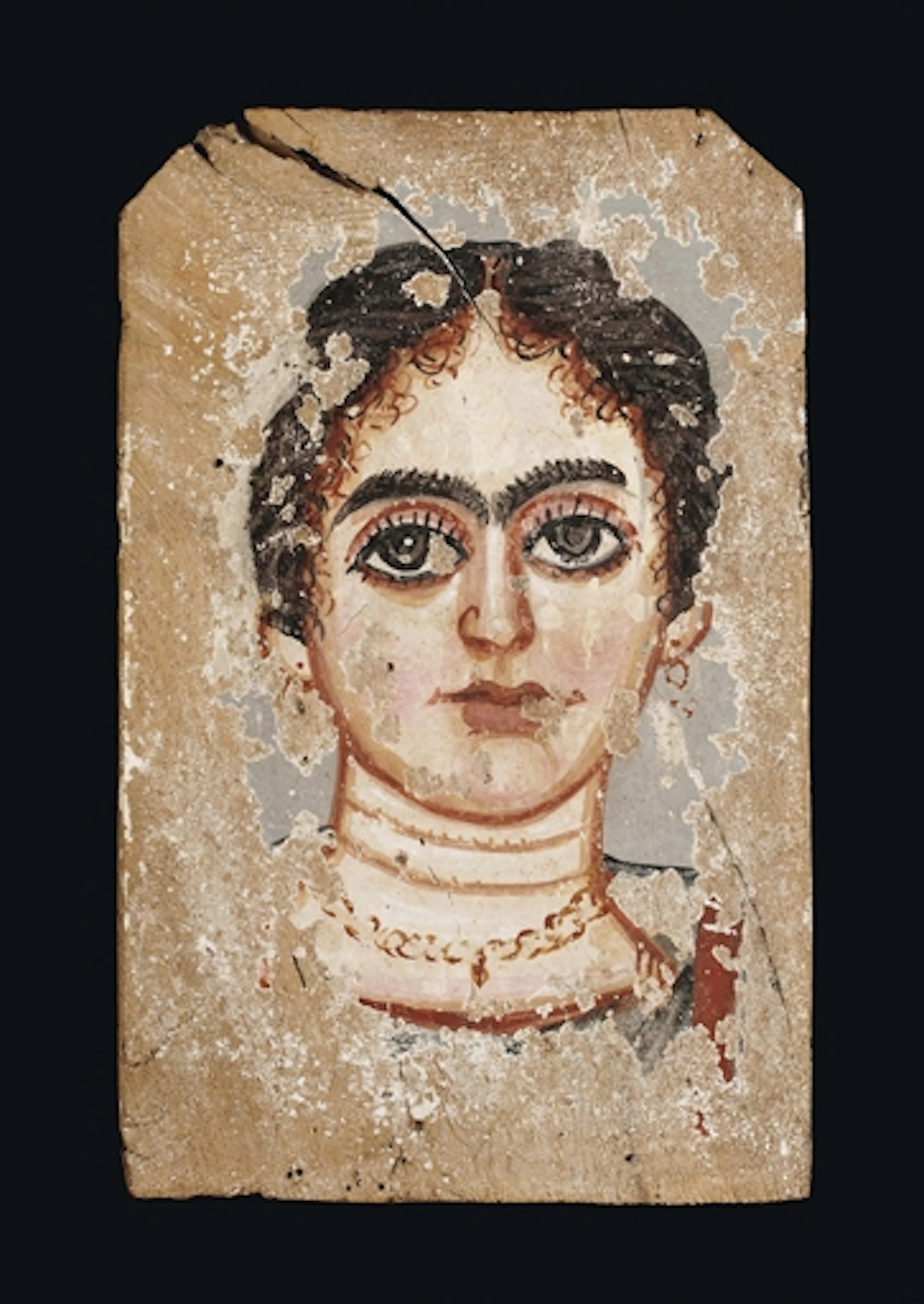 AN EGYPTIAN PAINTED WOOD MUMMY PORTRAIT OF A WOMAN