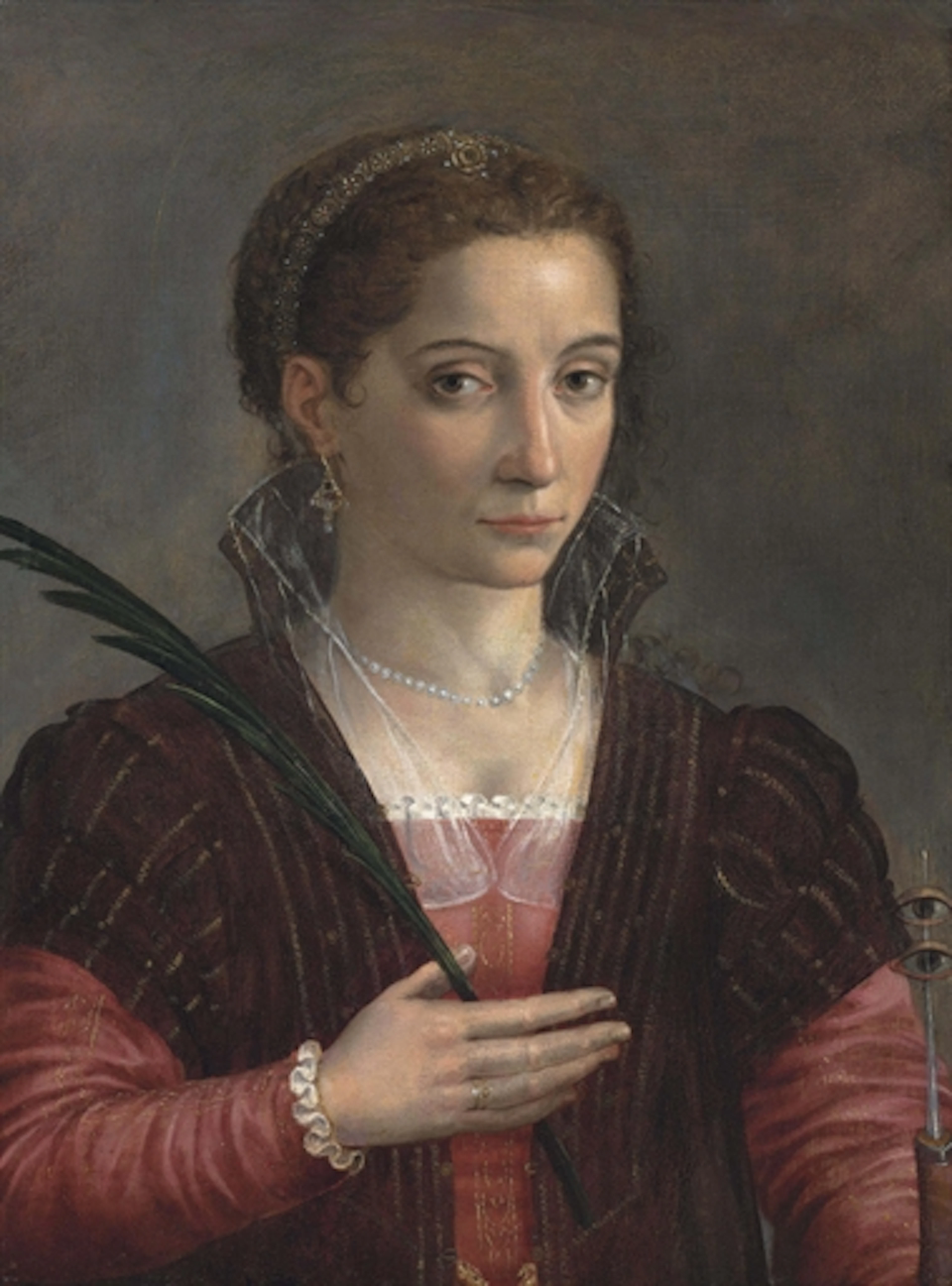 Portrait of a lady, as Saint Lucy, half-length, in a red embroidered dress and brown mantle