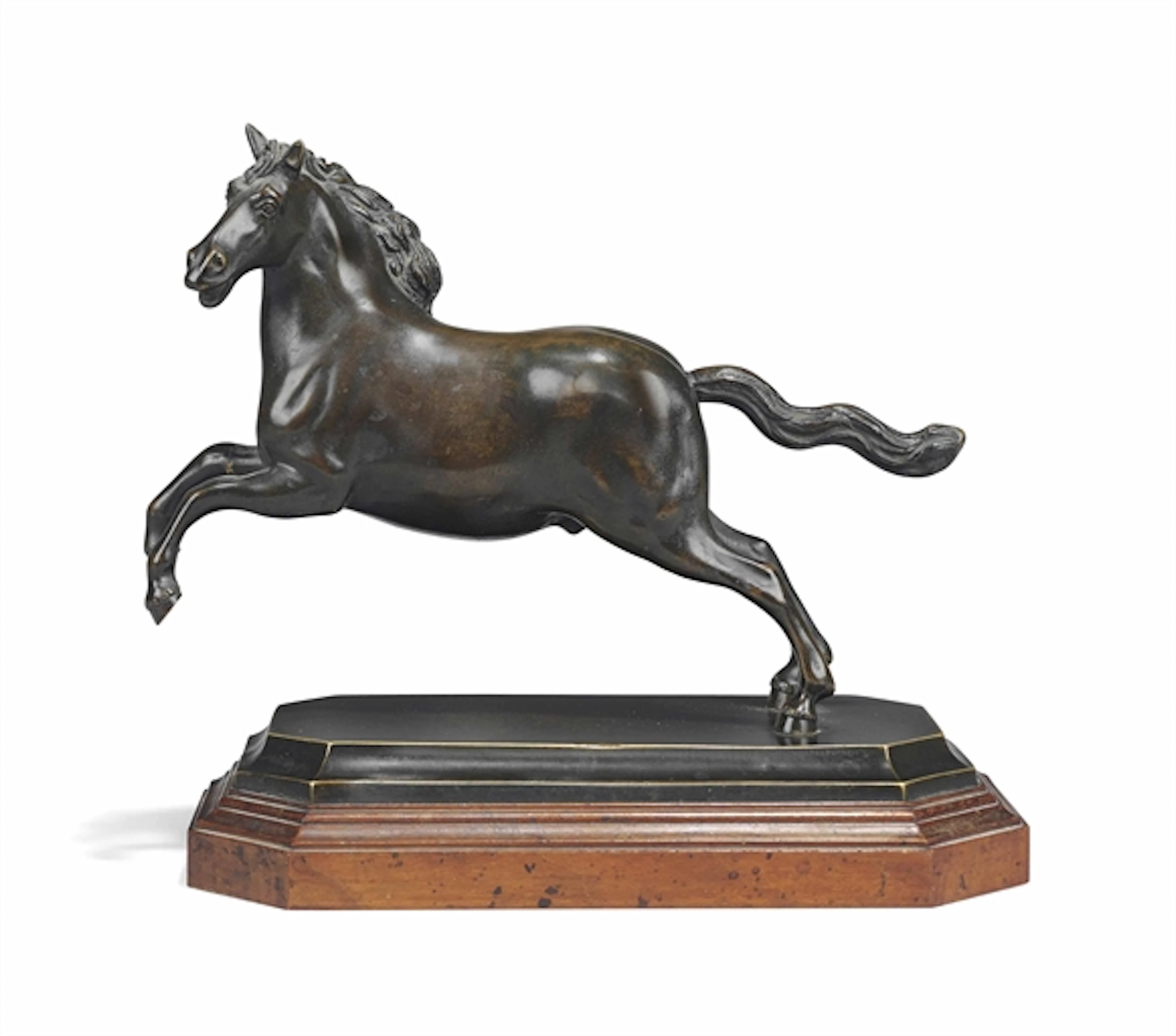 A BRONZE MODEL OF A REARING HORSE
