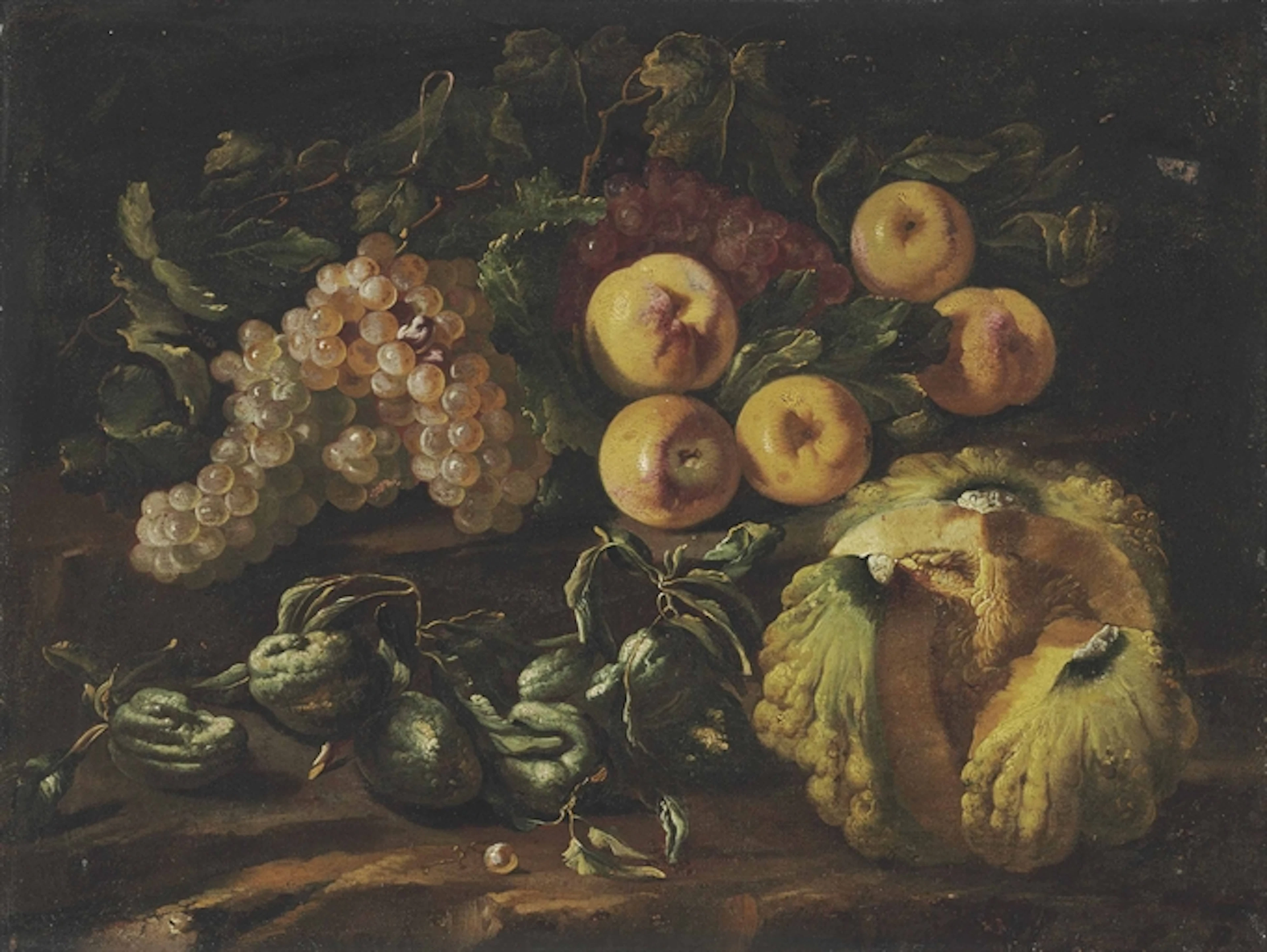Grapes, apples, a melon and other fruit on a stone ledge
