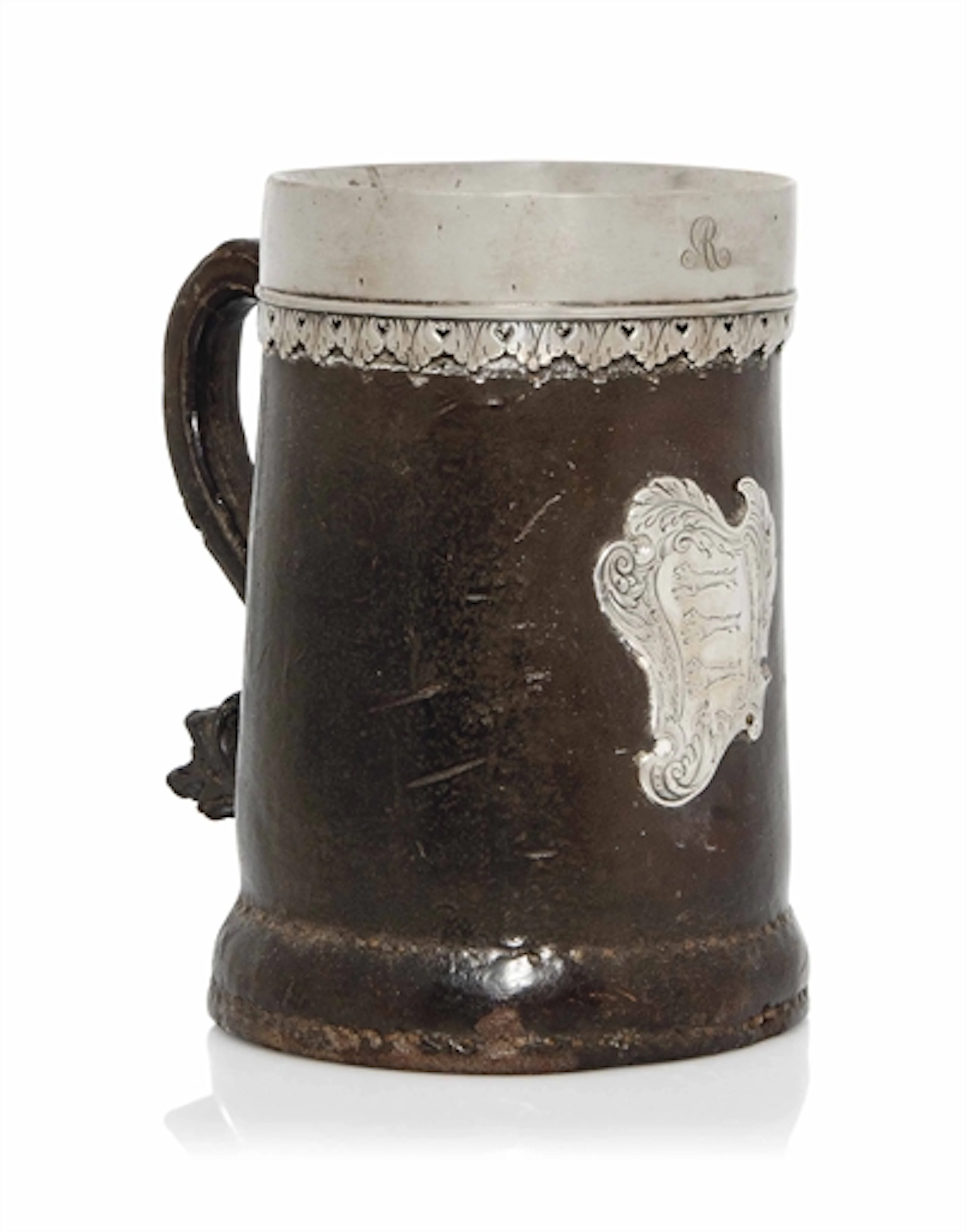 A GEORGE II LEATHER AND SILVER-MOUNTED TANKARD