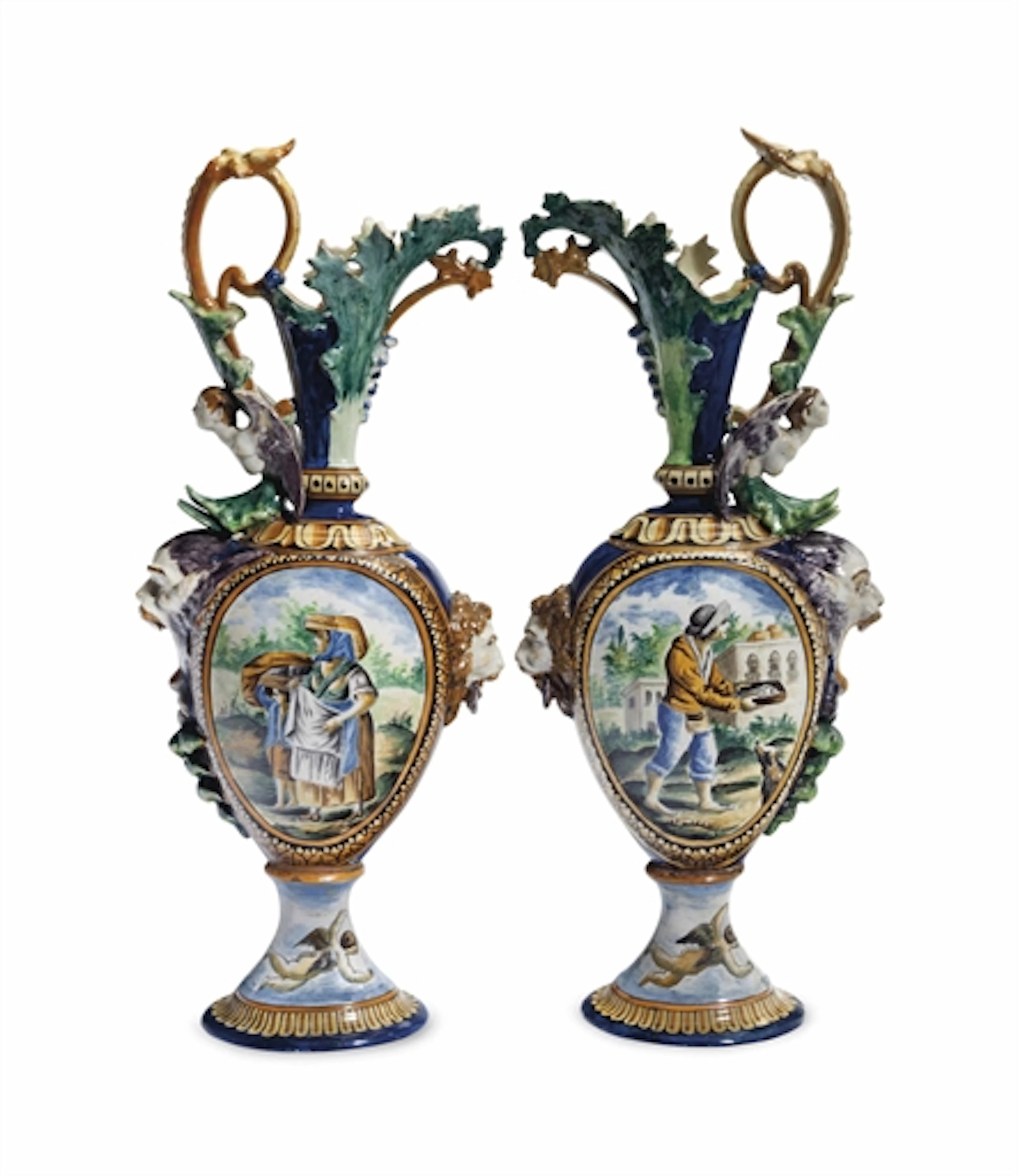 A PAIR OF ITALIAN MAIOLICA EWERS