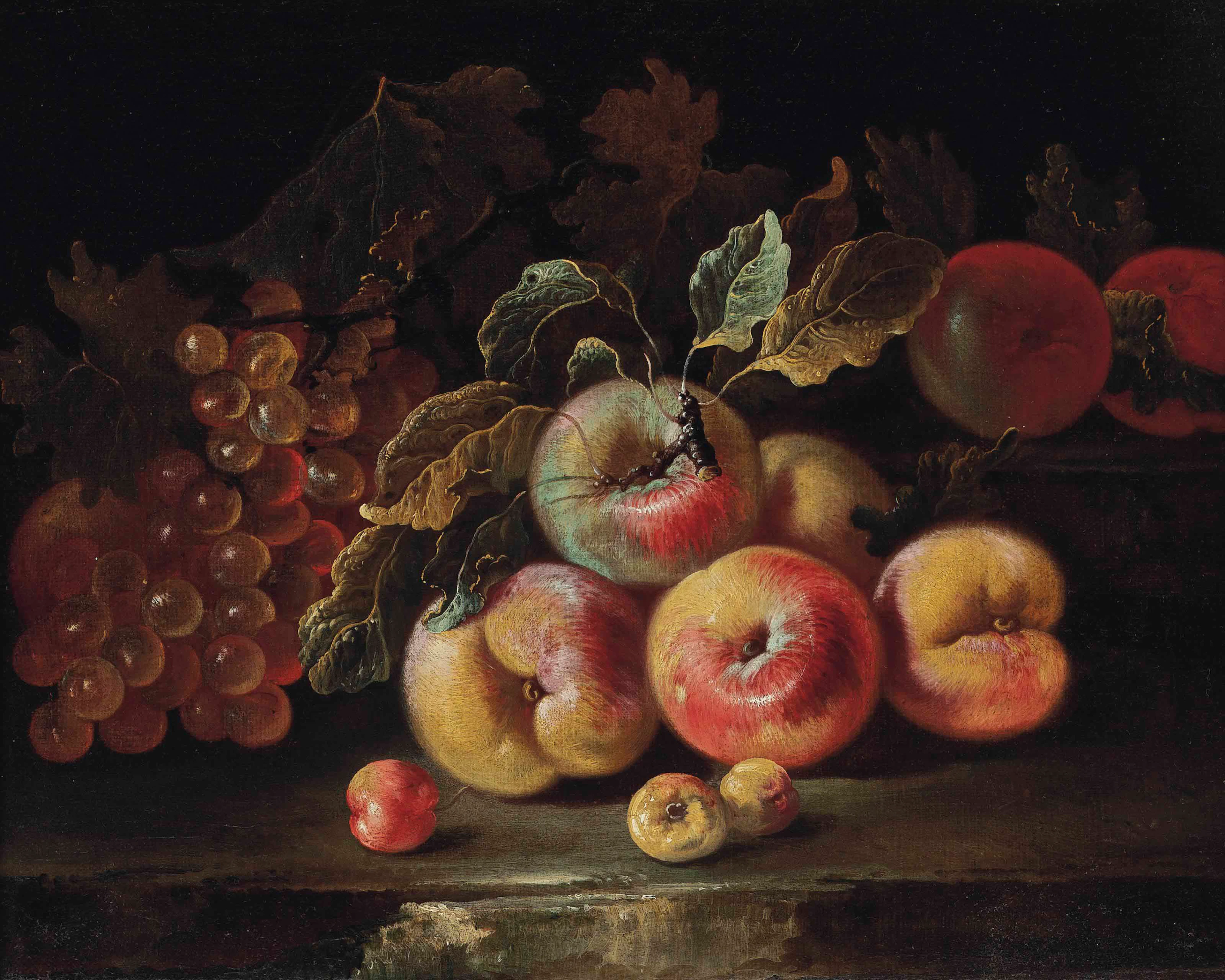 Peaches, grapes and plums on a stone ledge