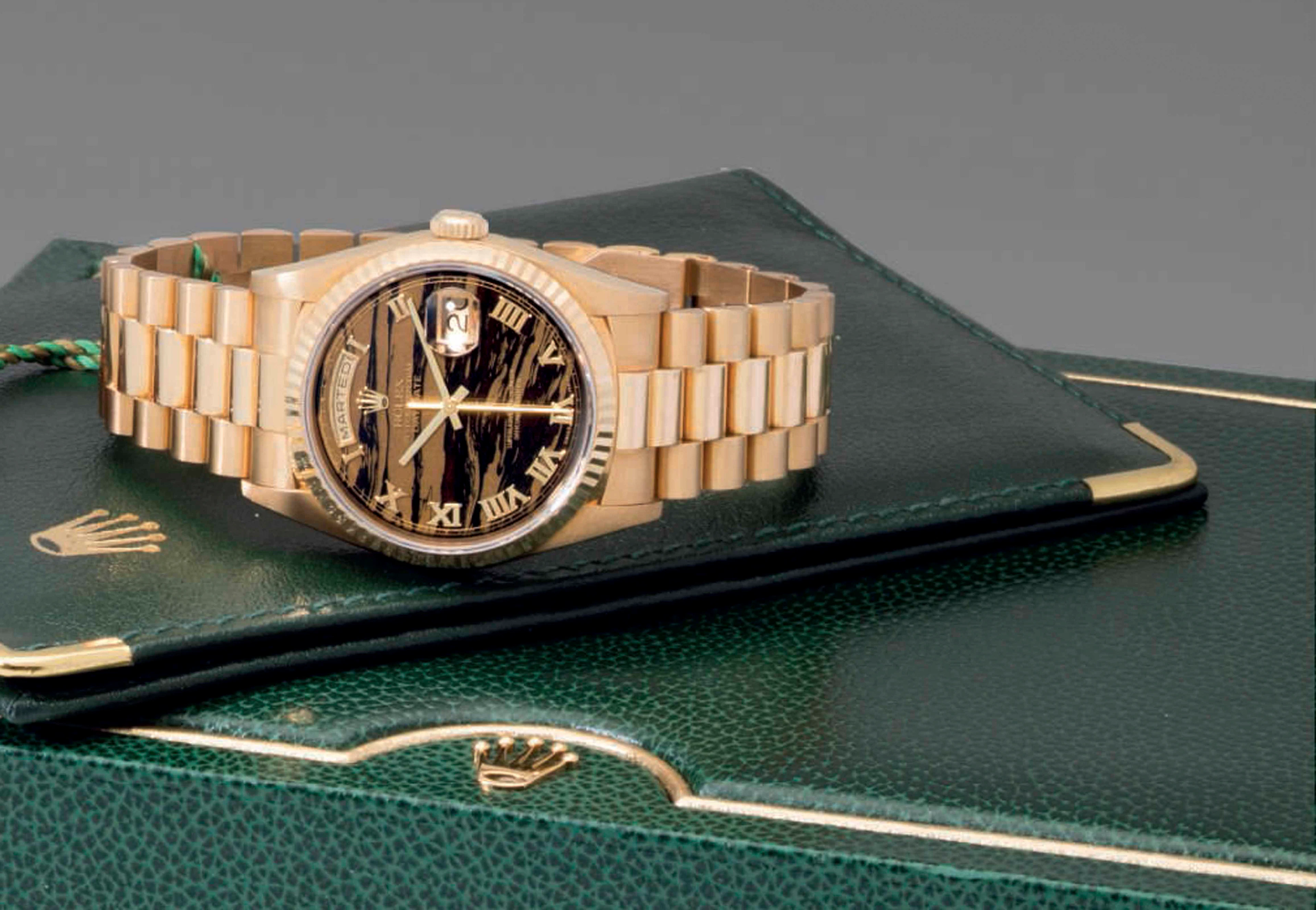 Rolex. A Very Fine and Rare 18k Gold Wristwatch with Day