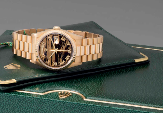 Rolex. A Very Fine and Rare 18k Gold Wristwatch with Day