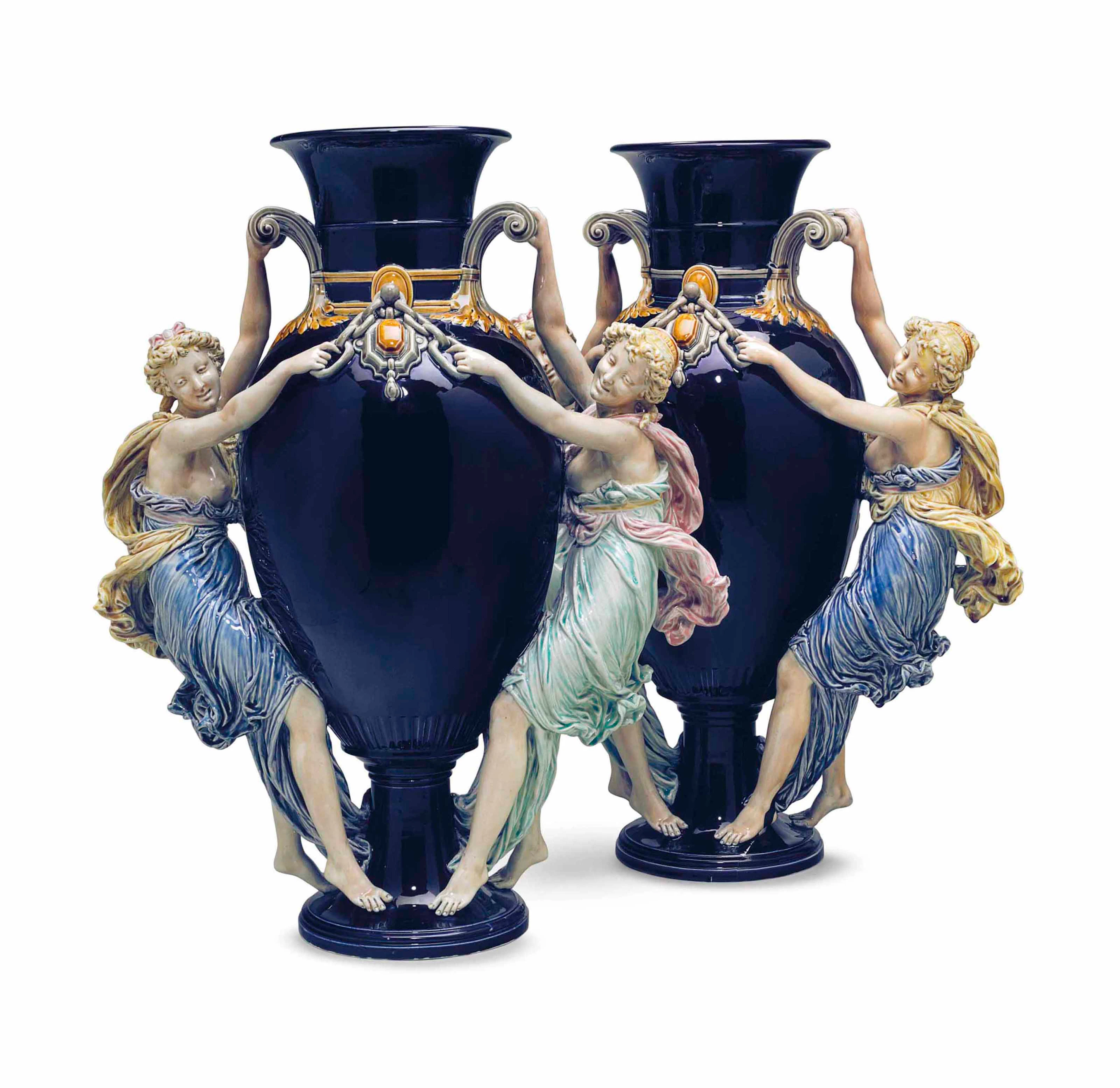 A pair of choisy le roi majolica cobalt-blue ground figural vases