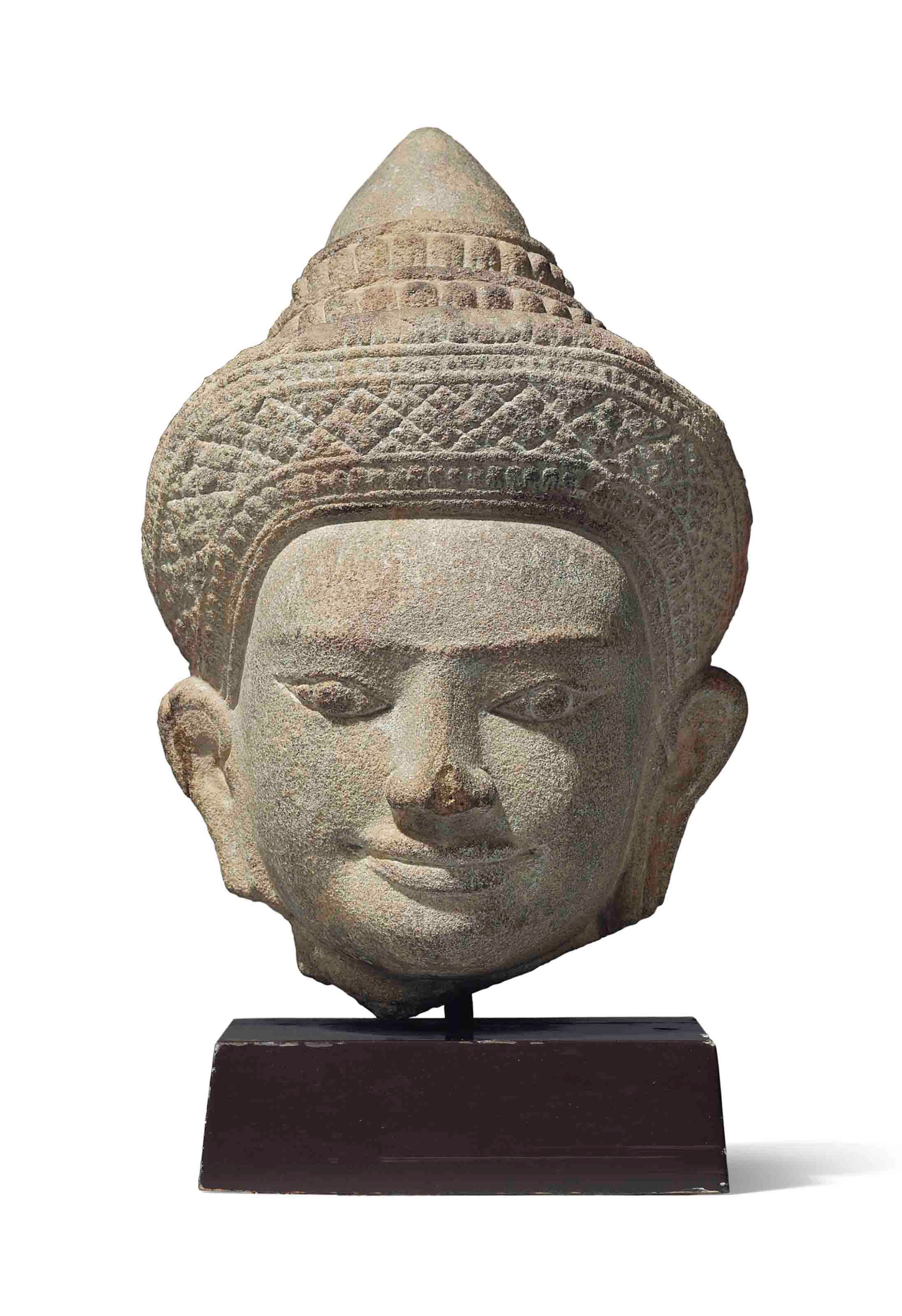 A sandstone head of vishnu