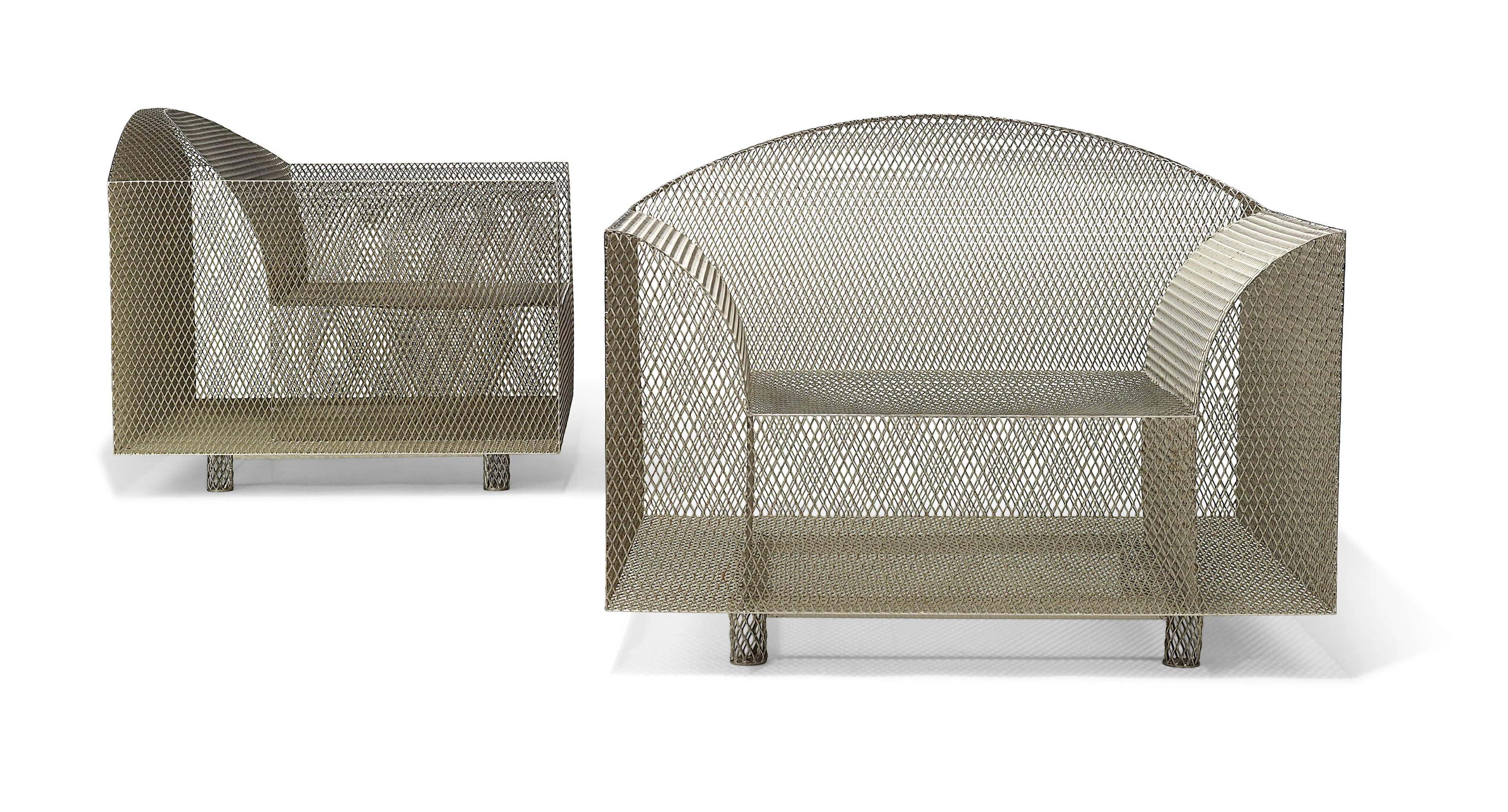 A pair of 'How High the Moon' armchairs