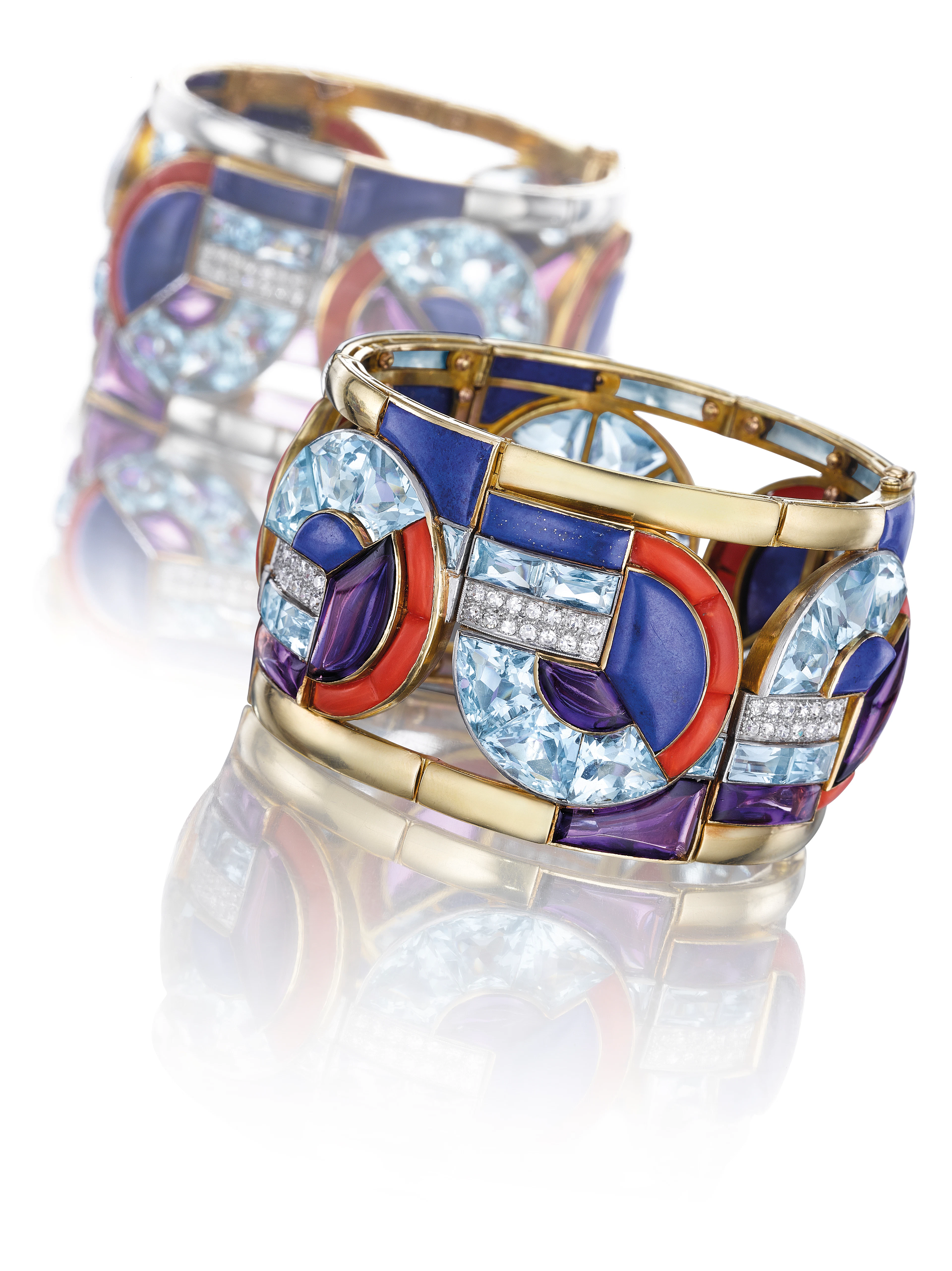 A RARE ART DECO MULTI-GEM AND DIAMOND BANGLE BRACELET, BY GE...
