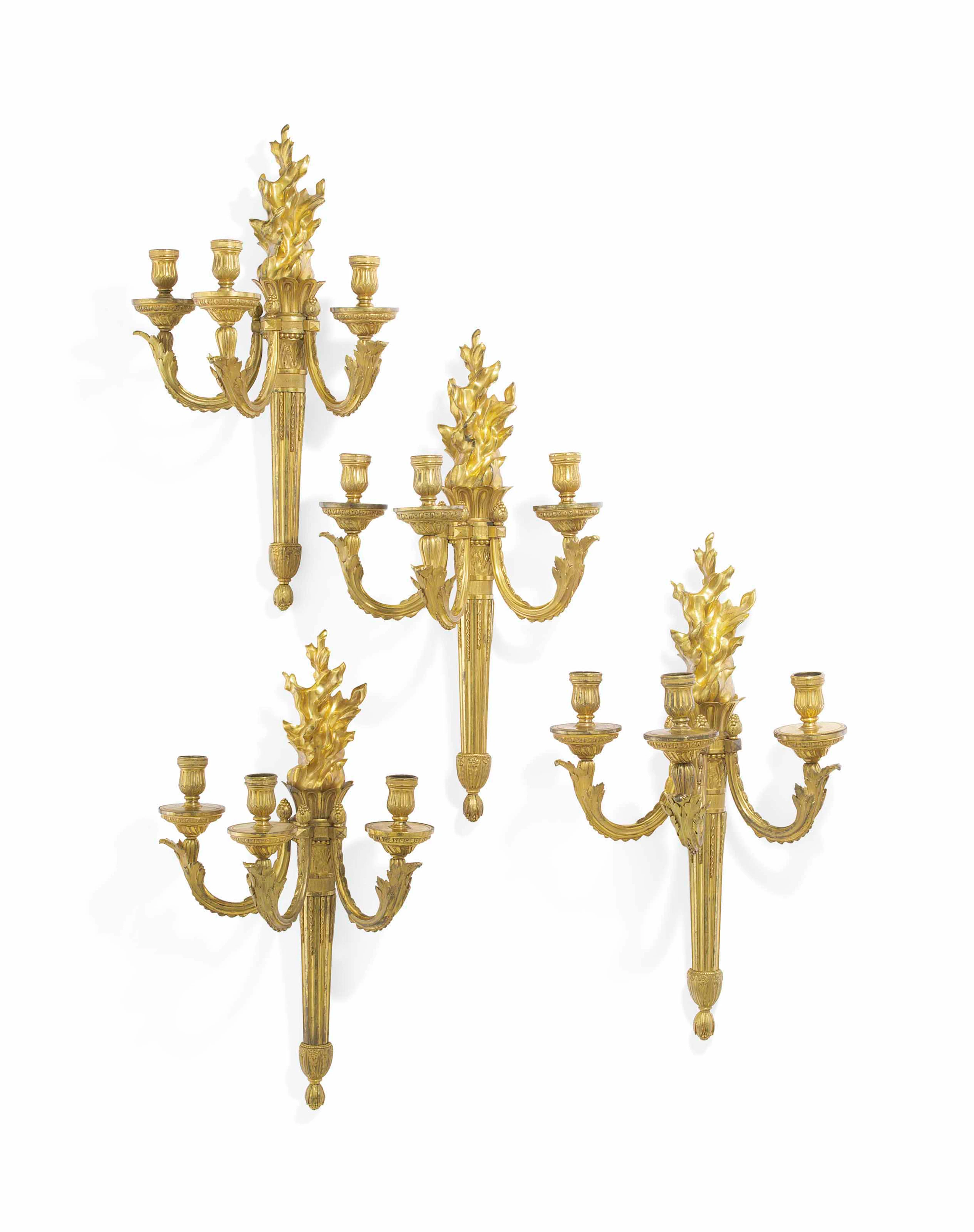 A MATCHED SET OF FOUR LOUIS XVI ORMOLU THREE-BRANCH WALL-LIG... ATTRIBUTED
