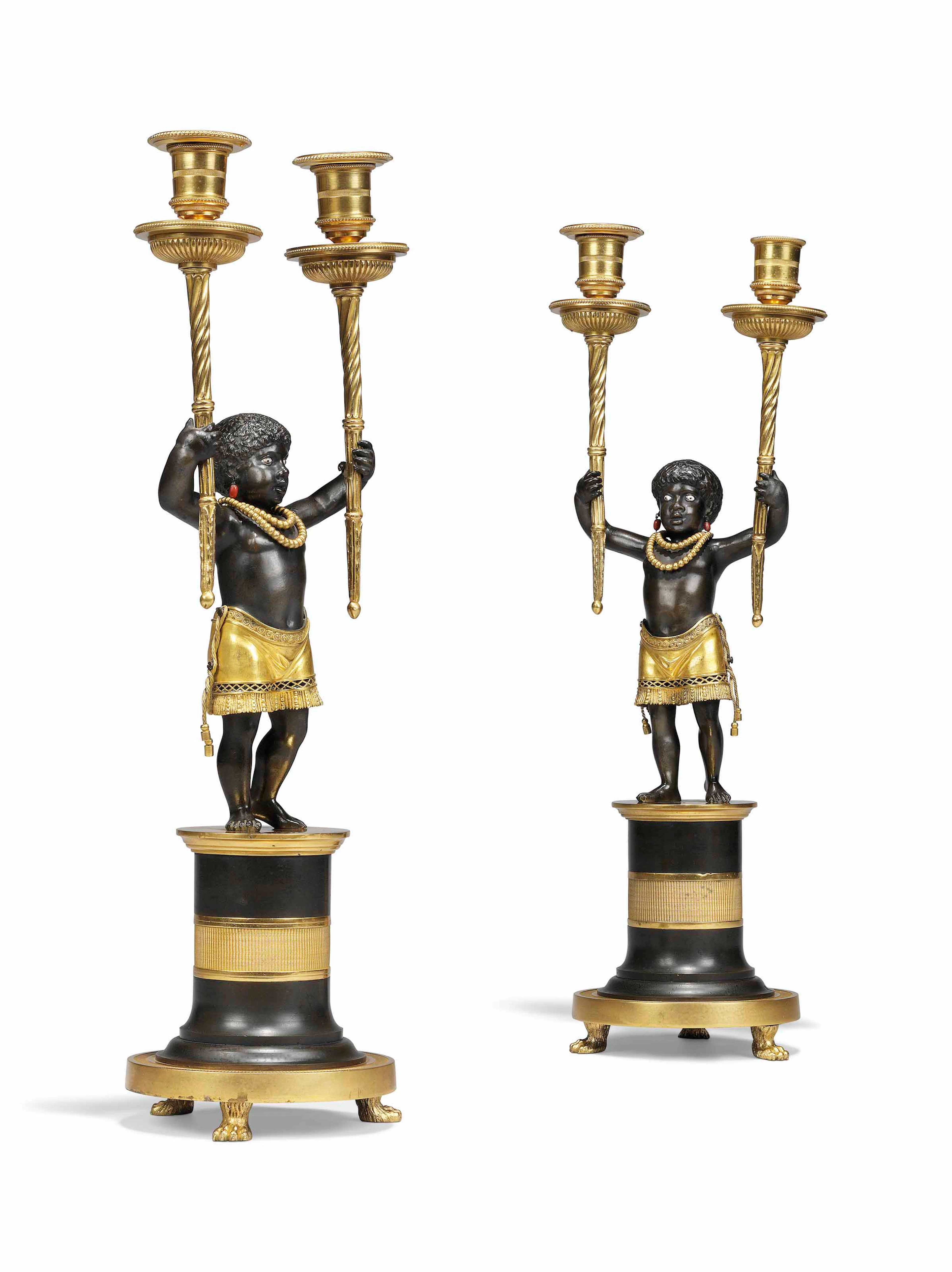 A pair of empire ormolu and patinated-bronze figural two-light candelabra