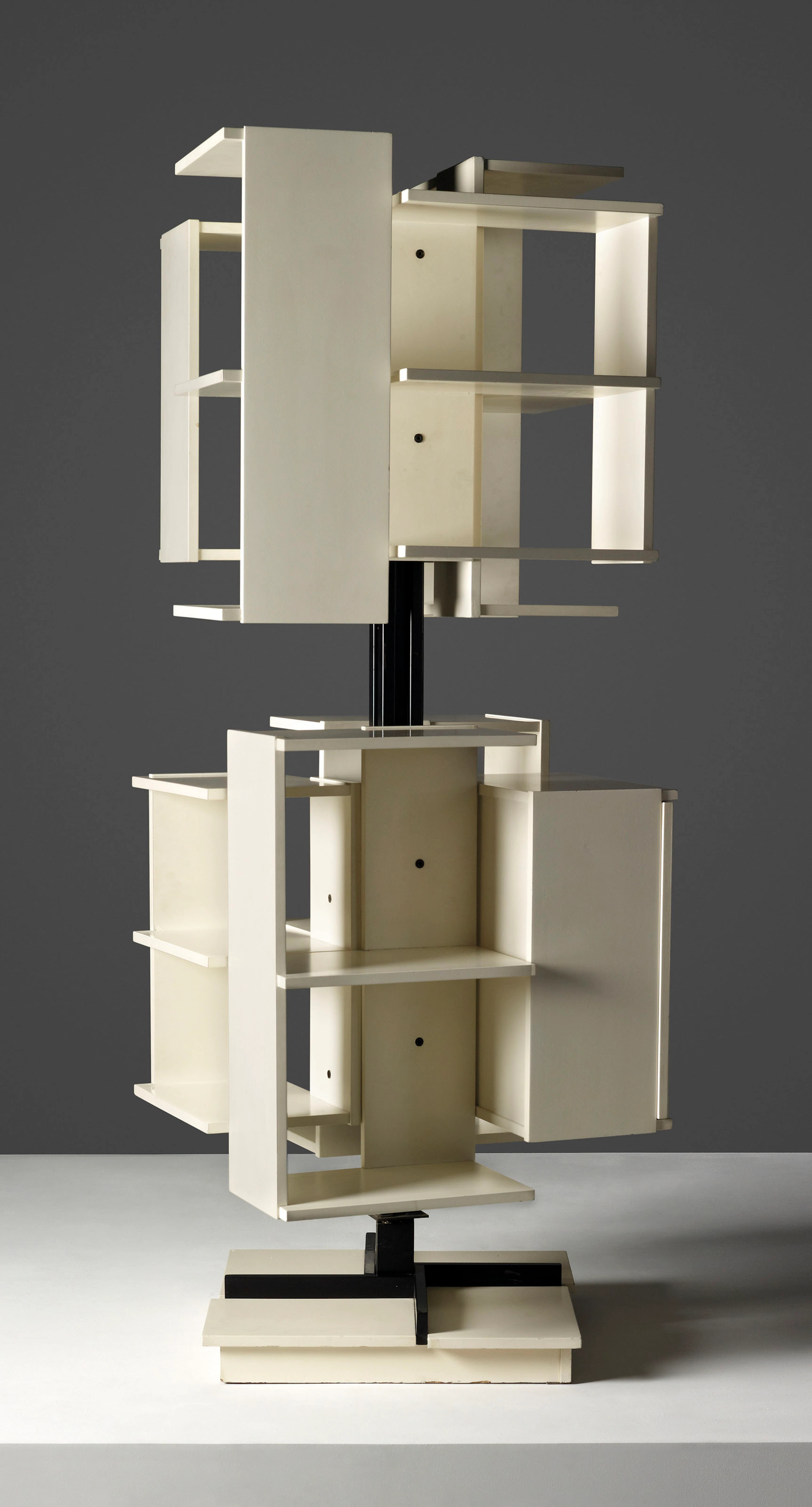 A REVOLVING BOOKCASE, DESIGNED 1960