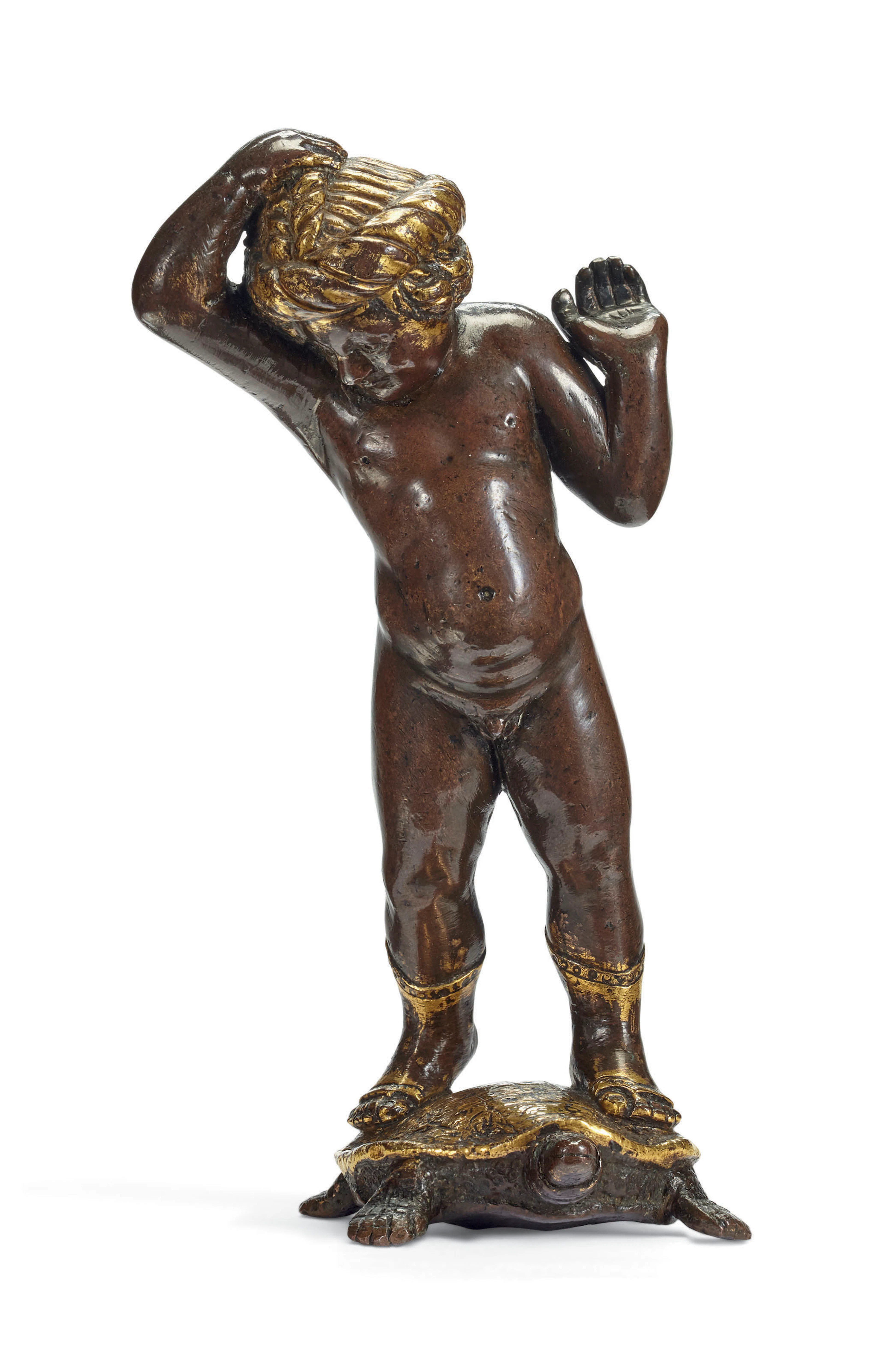 A PARCEL-GILT BRONZE FIGURE OF A PUTTO STANDING ON A TORTOISE