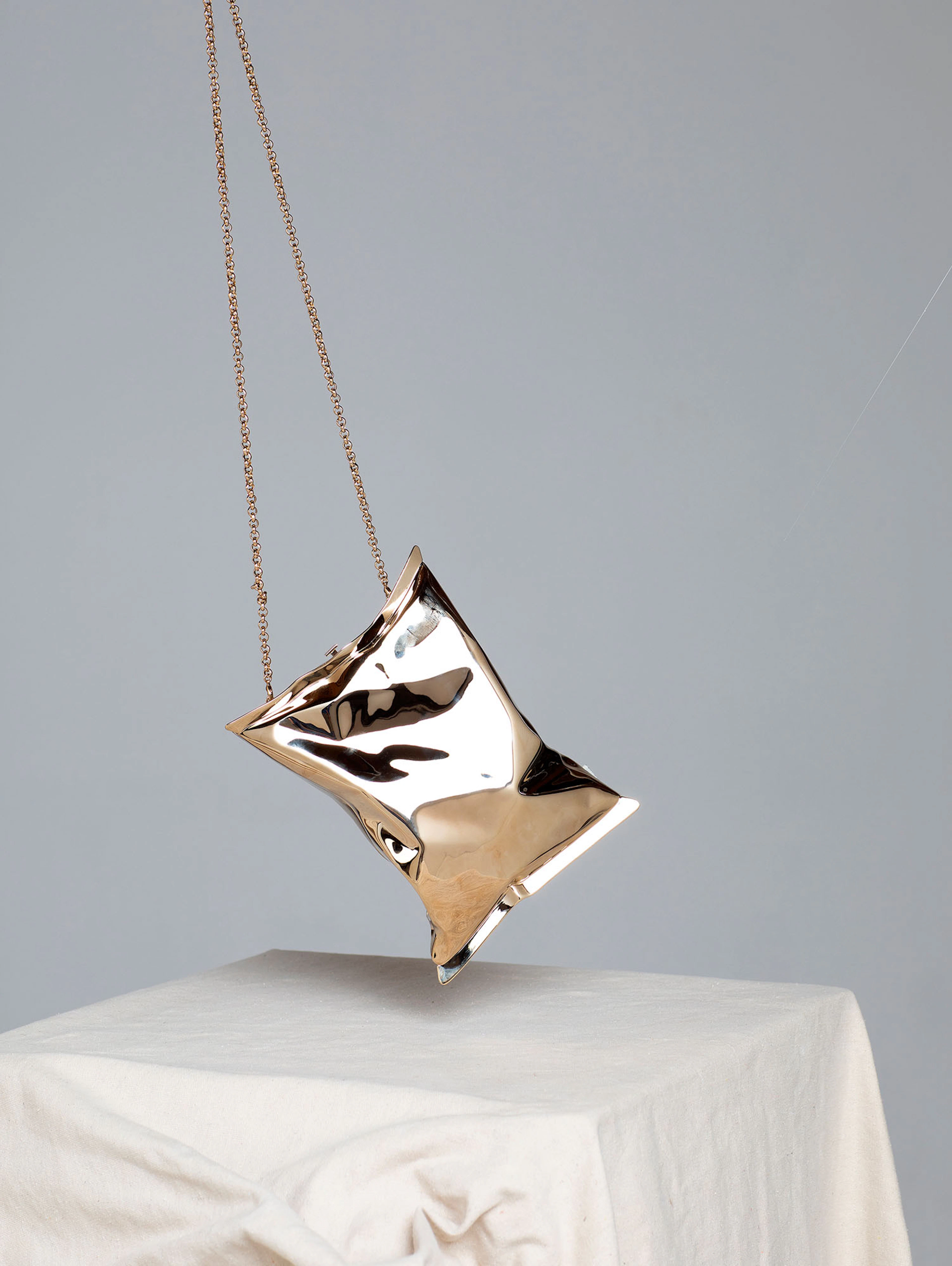 ANYA HINDMARCH'S PALE GOLD BRASS METALLIC CRISP PACKET II
