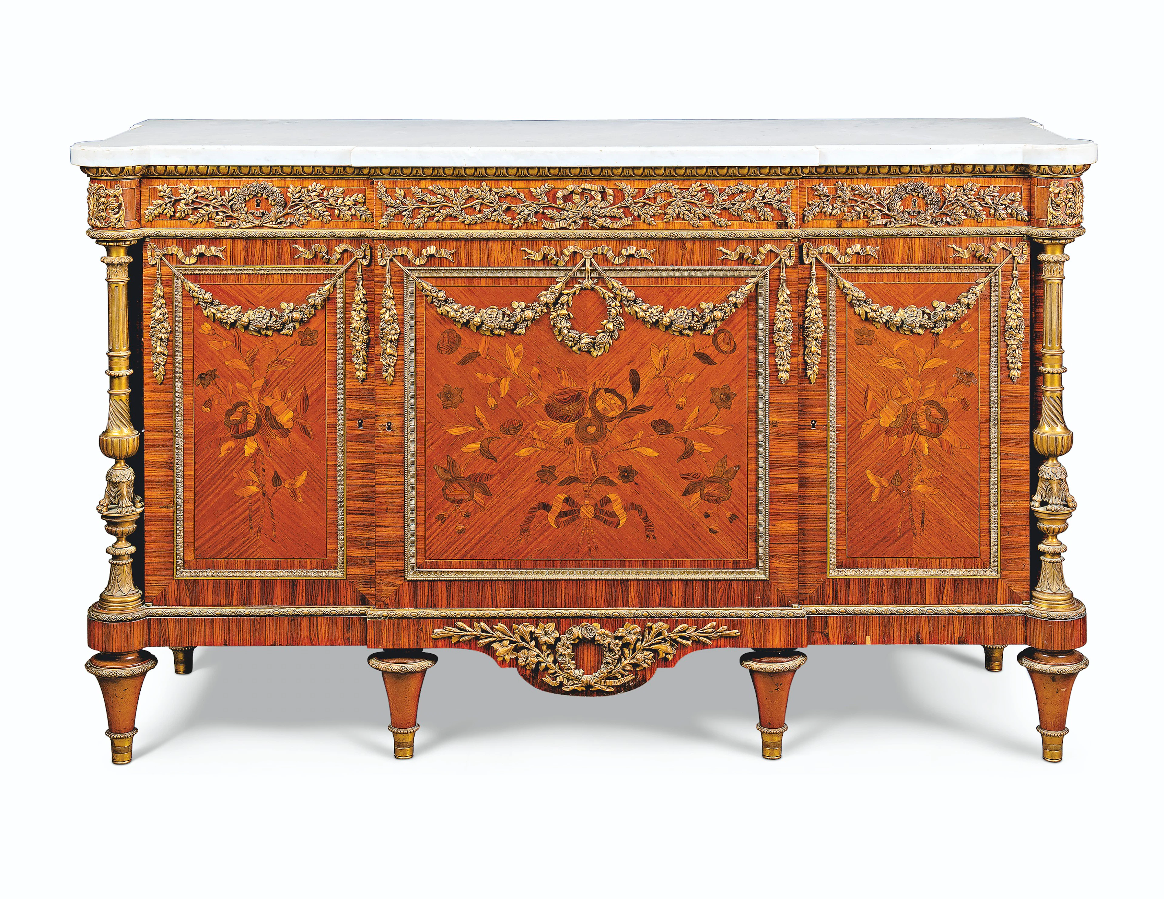 A FRENCH ORMOLU-MOUNTED KINGWOOD, MAHOGANY, AND MARQUETRY COMMODE