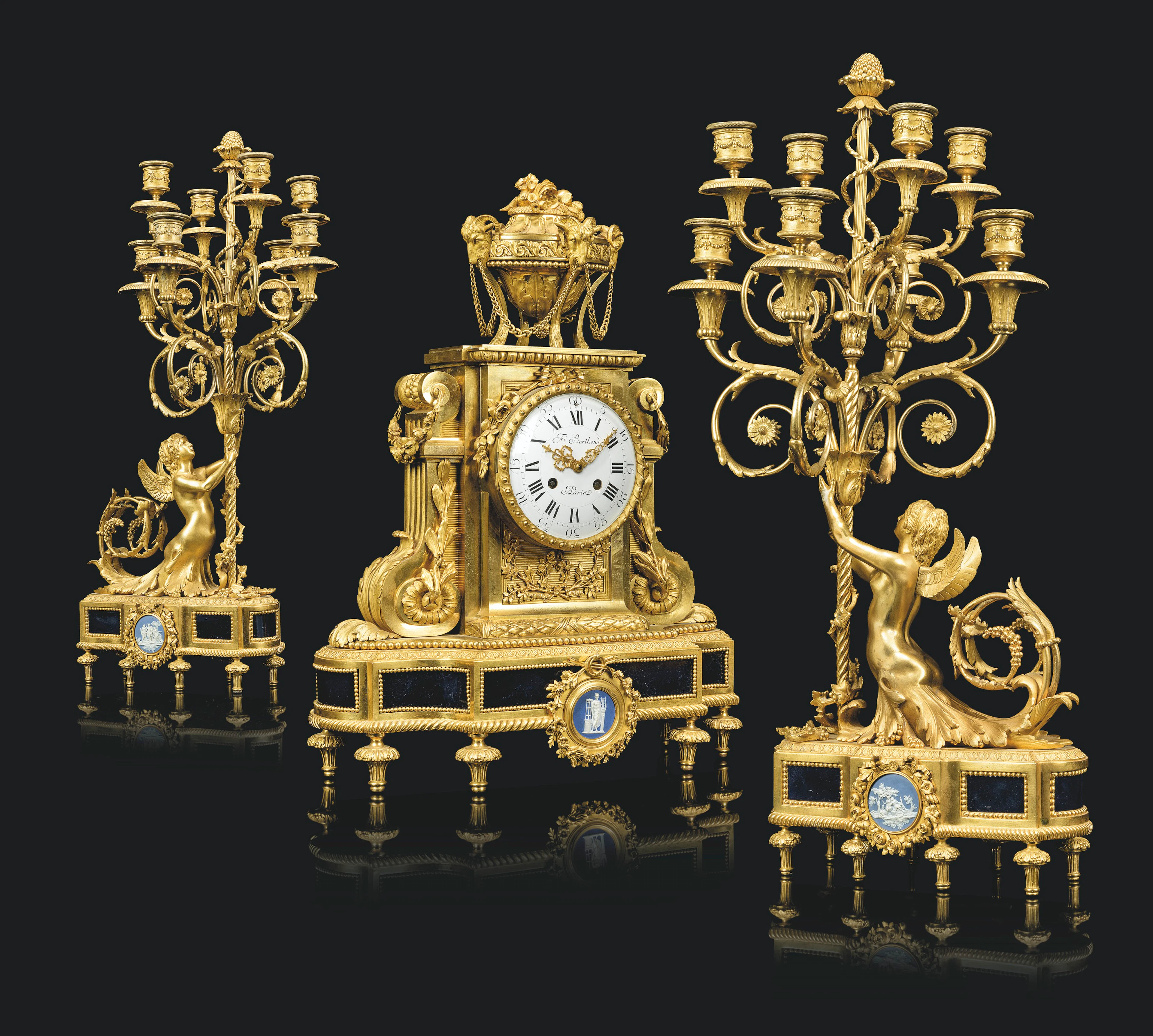 A FRENCH TOLE AND JASPERWARE-MOUNTED ORMOLU THREE-PIECE CLOCK GARNITURE