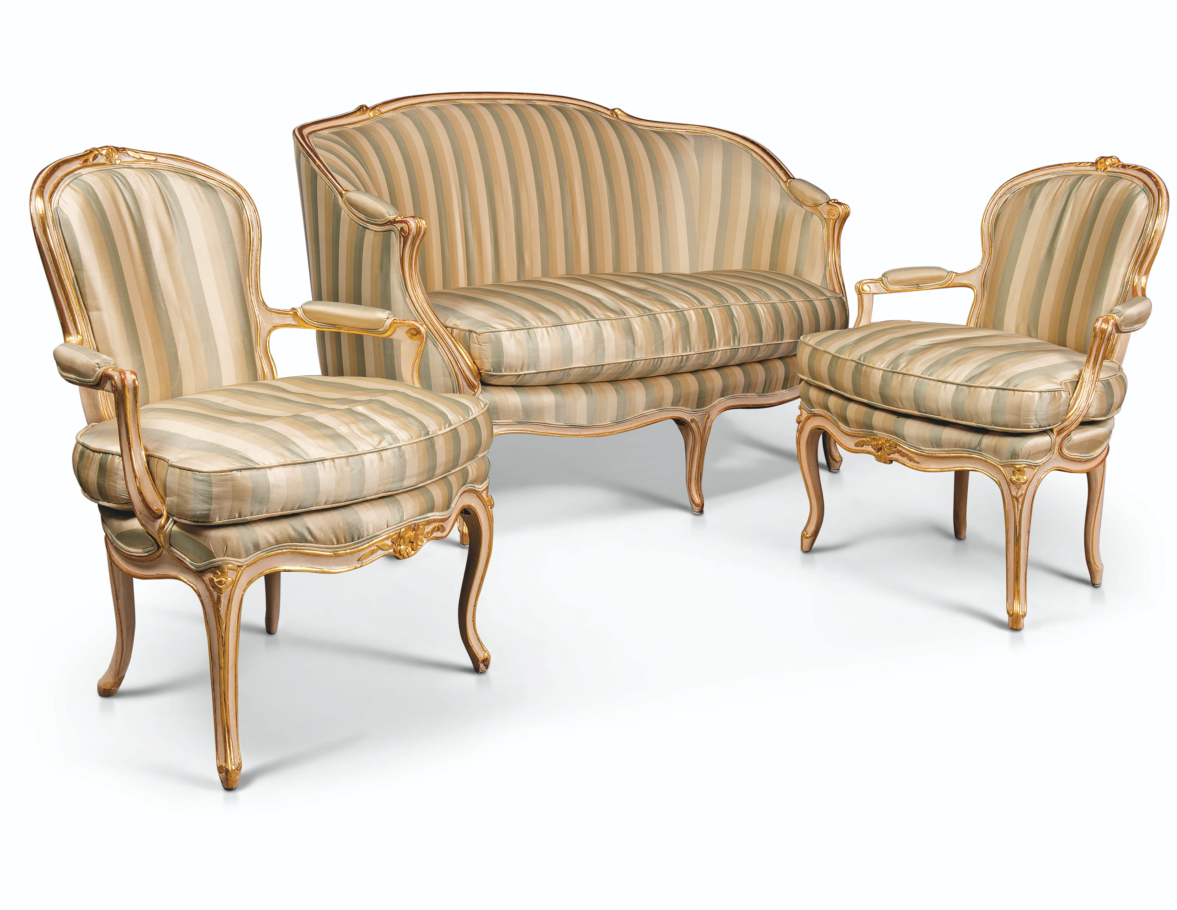 AN ASSEMBLED SET OF LOUIS XV CREAM-PAINTED AND PARCEL-GILT SEAT FURNITURE