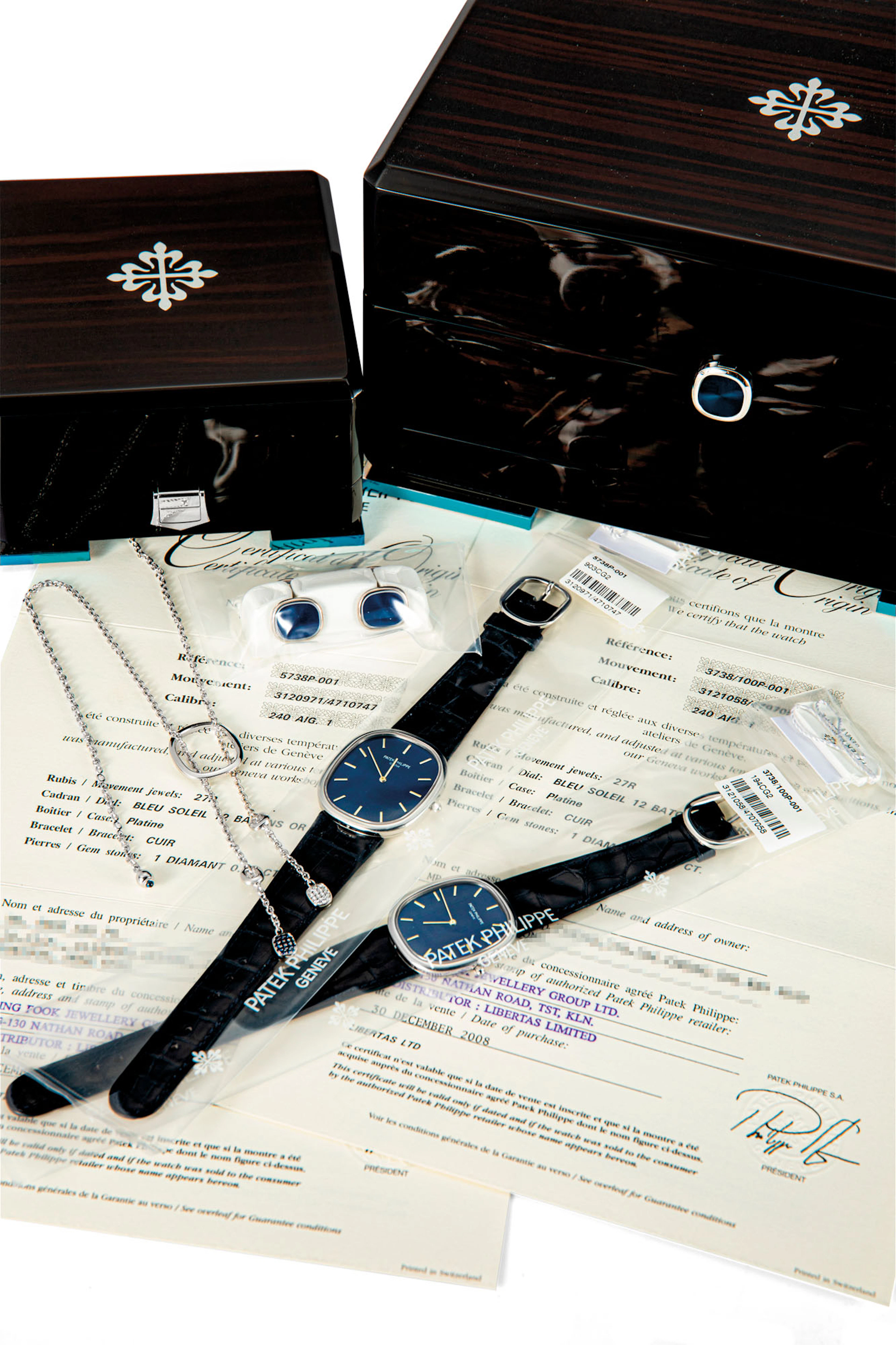 PATEK PHILIPPE. A RARE SET OF TWO PLATINUM LIMITED...