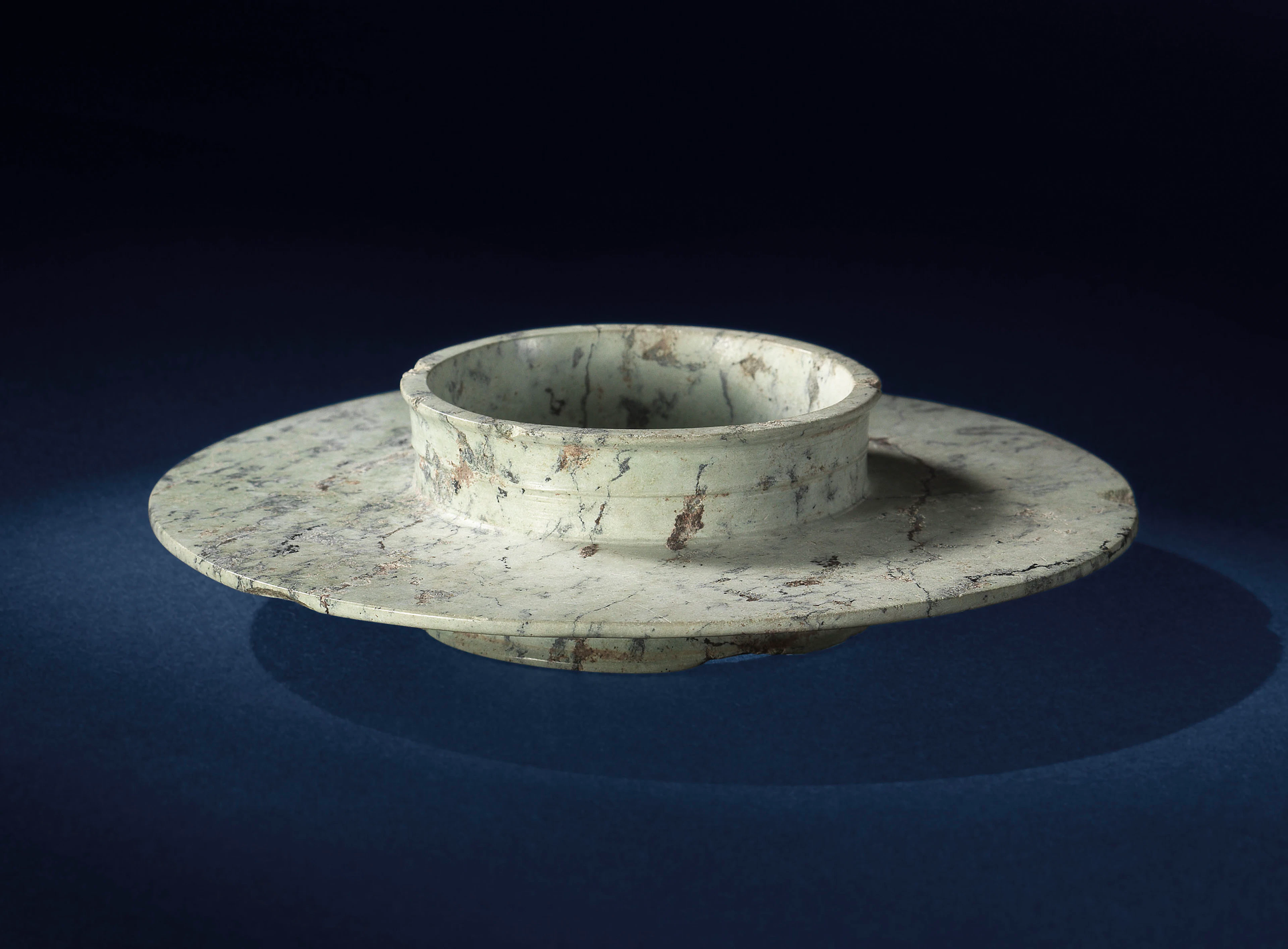 AN OPAQUE JADE COLLARED DISC