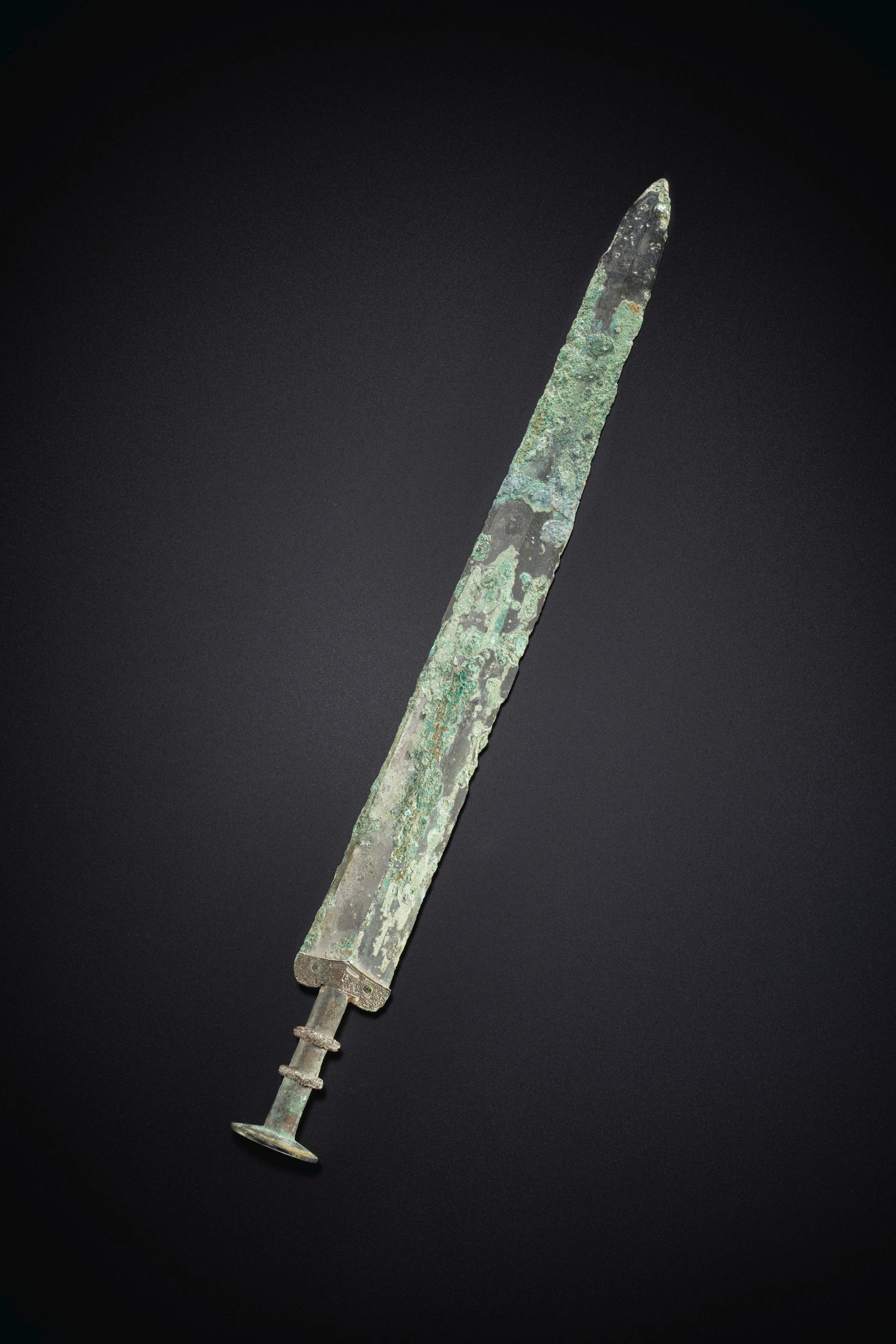 A FINELY CAST BRONZE SWORD