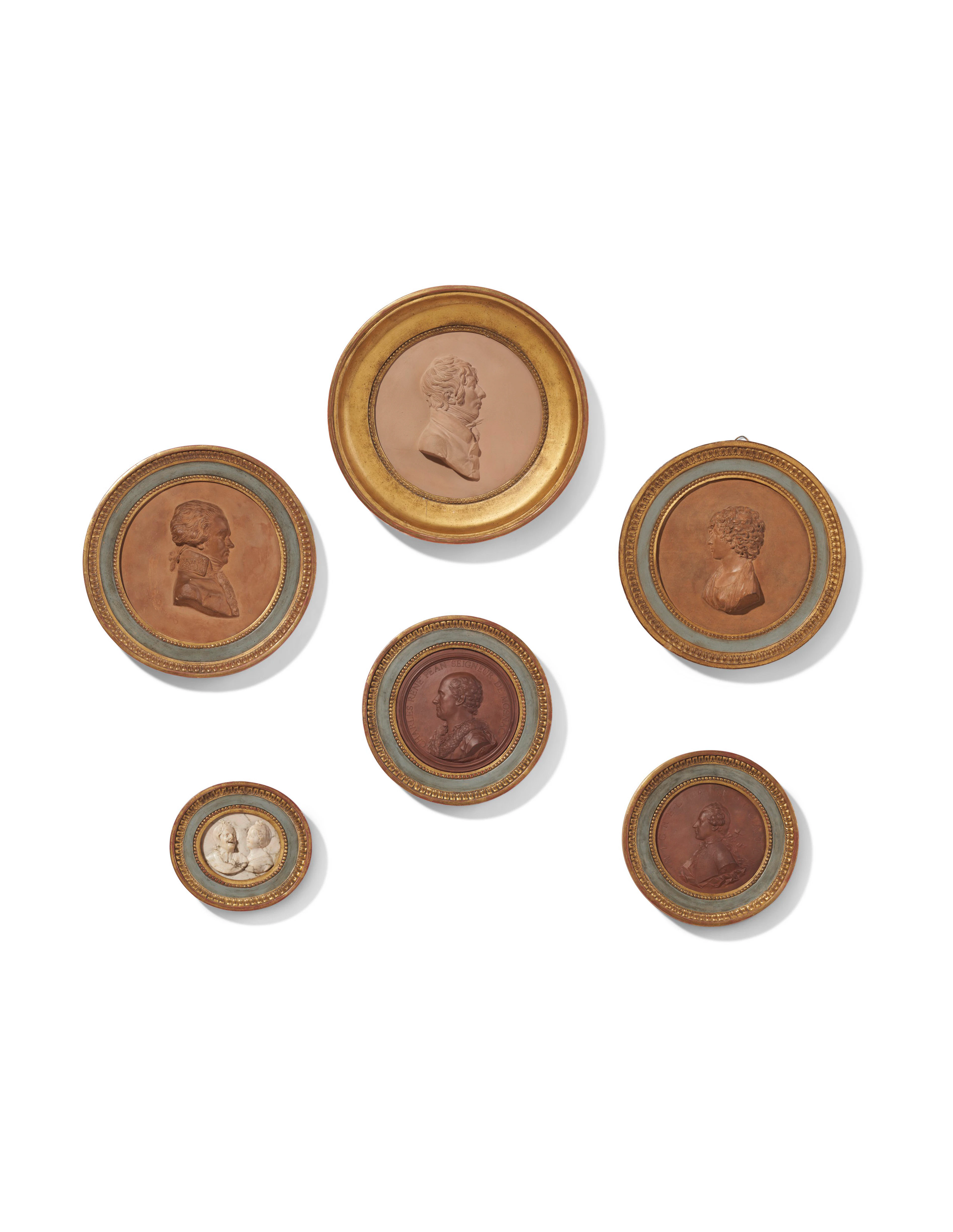 A GROUP OF SIX FRENCH TERRACOTTA AND ALABASTER CIRCULAR PROFILE RELIEFS